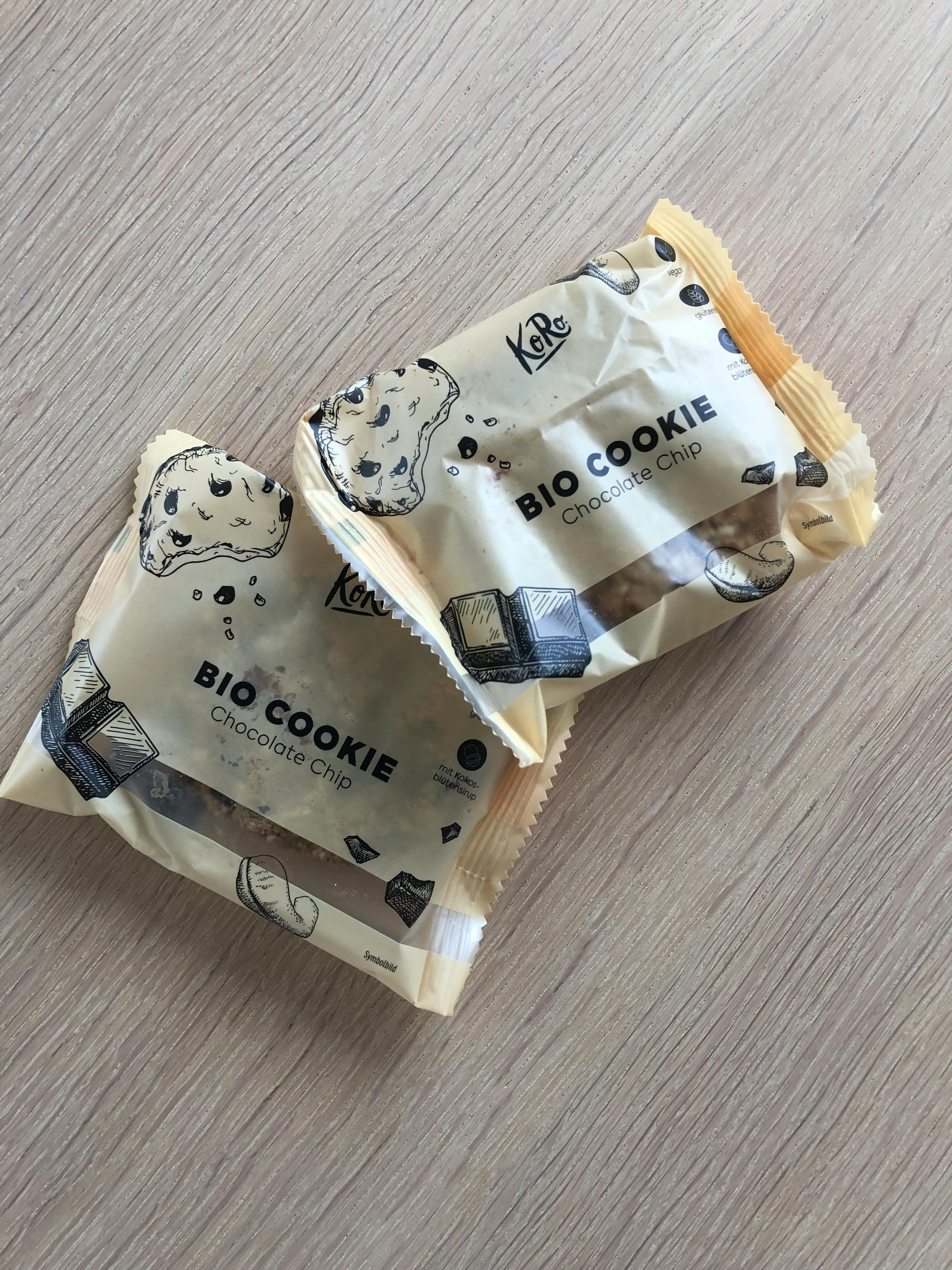 two bags of bio cookie chocolate chip cookies on a wooden table