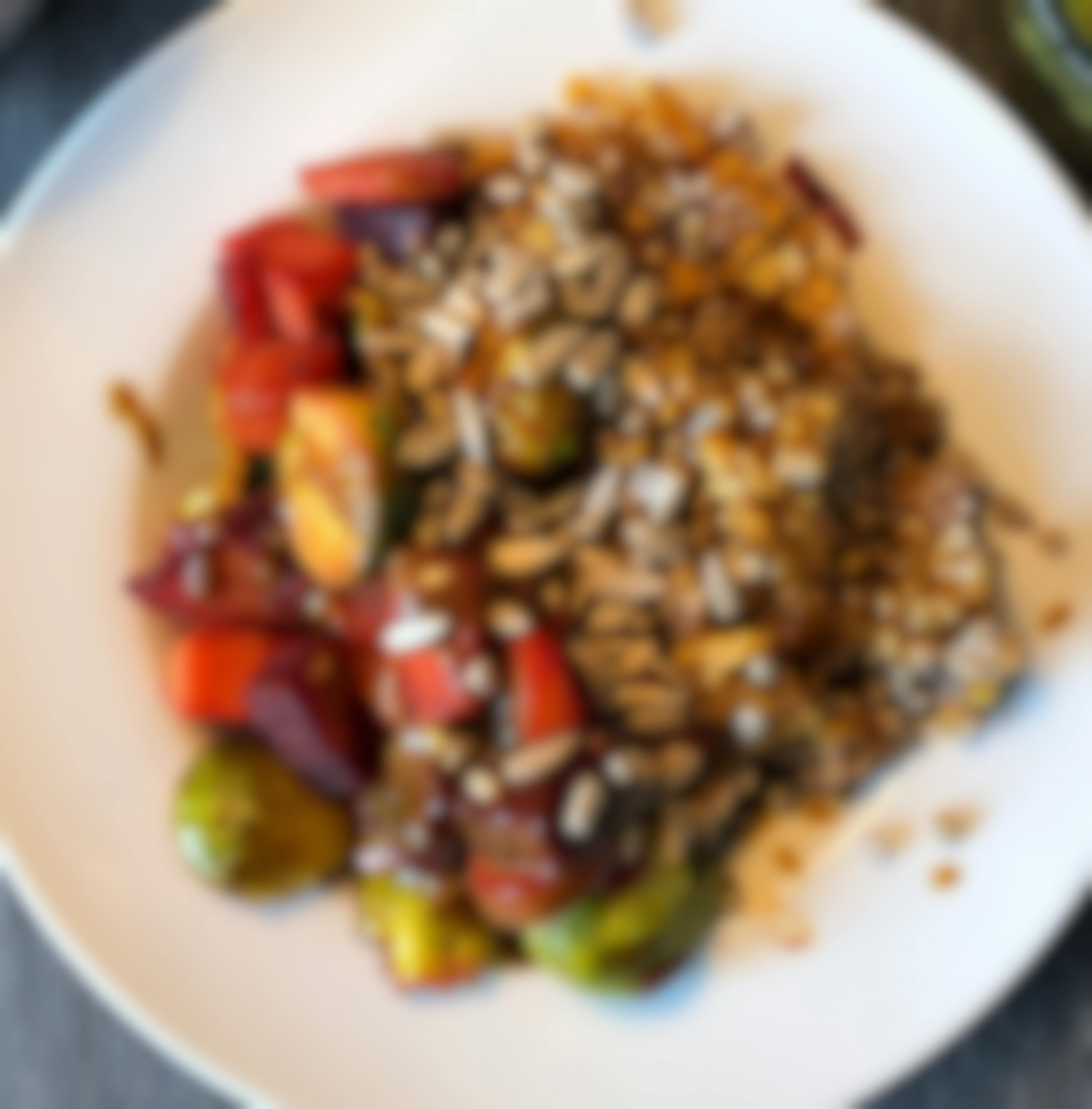 Buckwheat vegetable bowl with tahini sauce and seeds