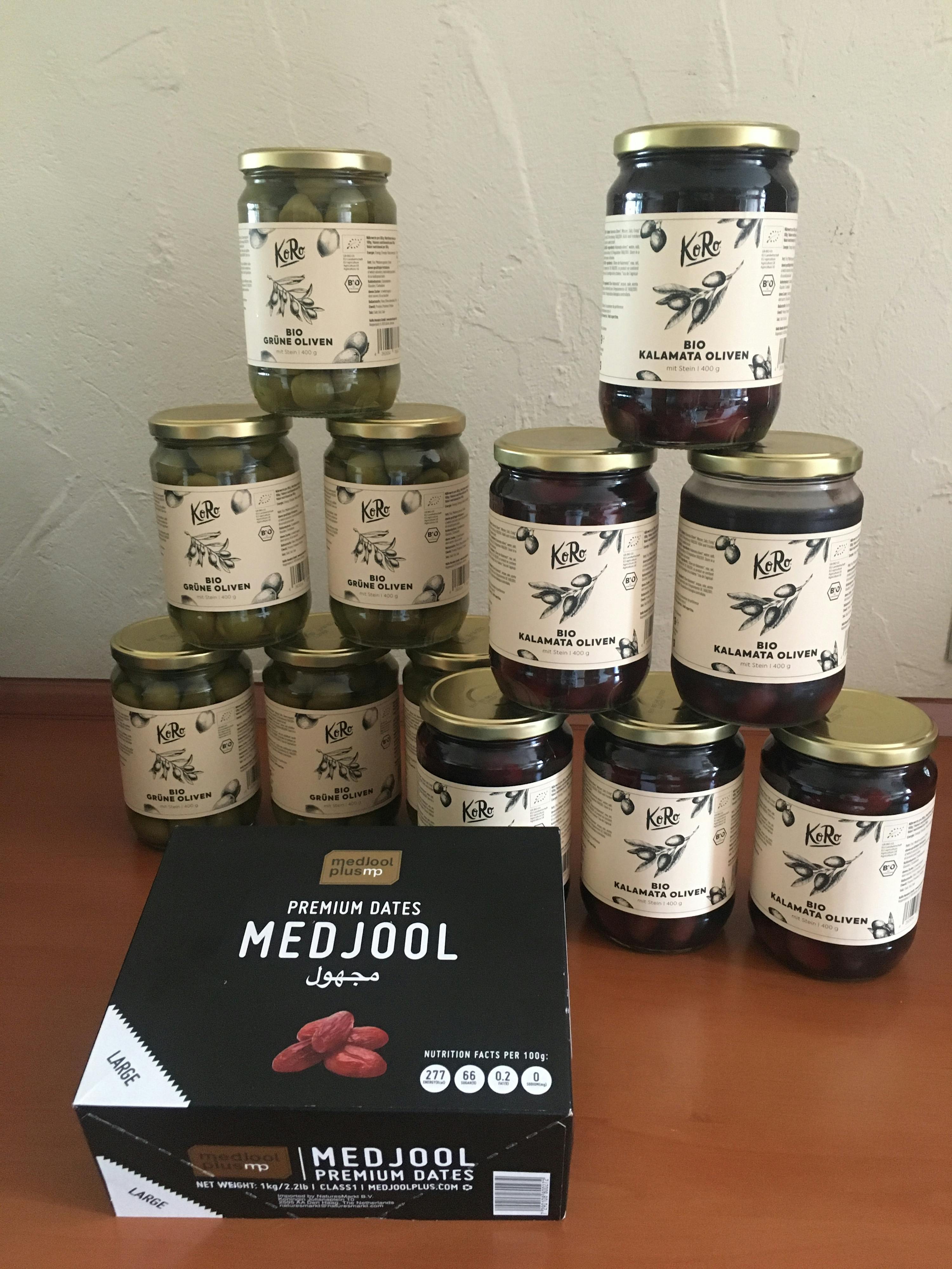 a box of medjool premium dates sits on a table
