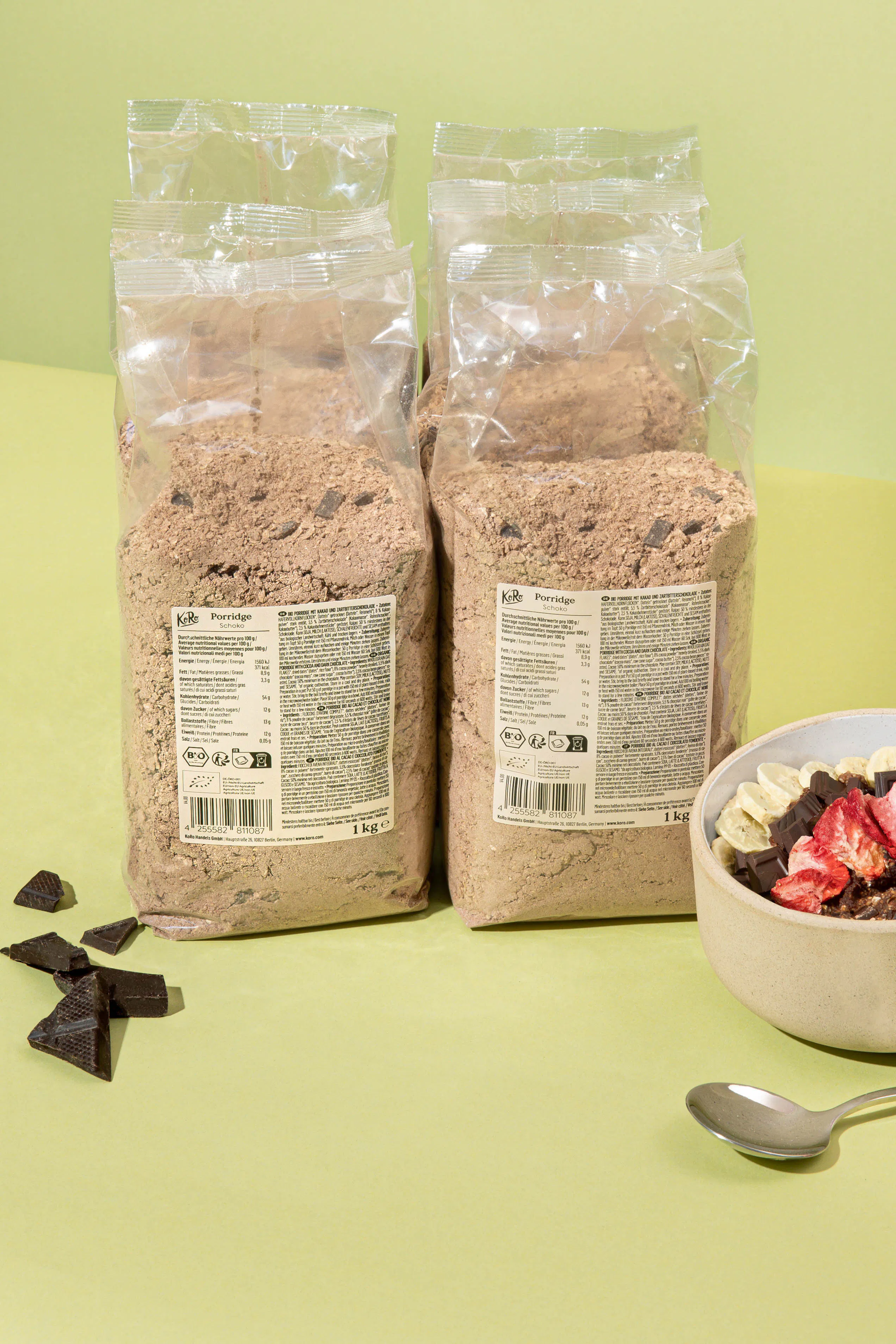two bags of kibs porridge next to a bowl of cereal