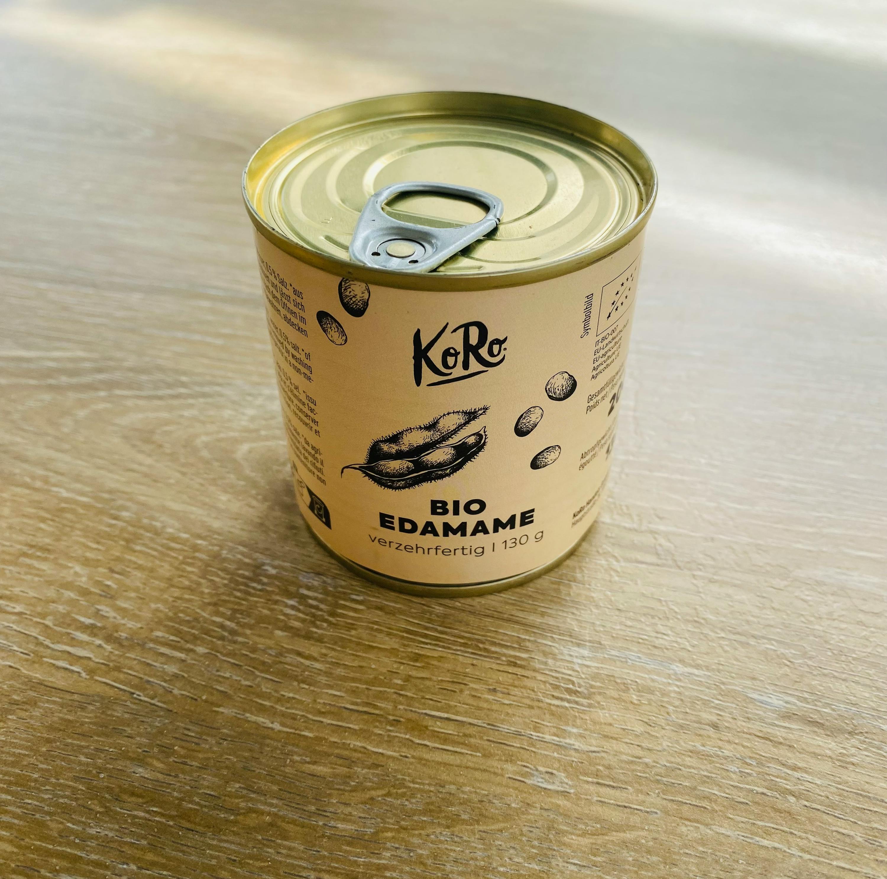 a can of koro bio edamame on a wooden table