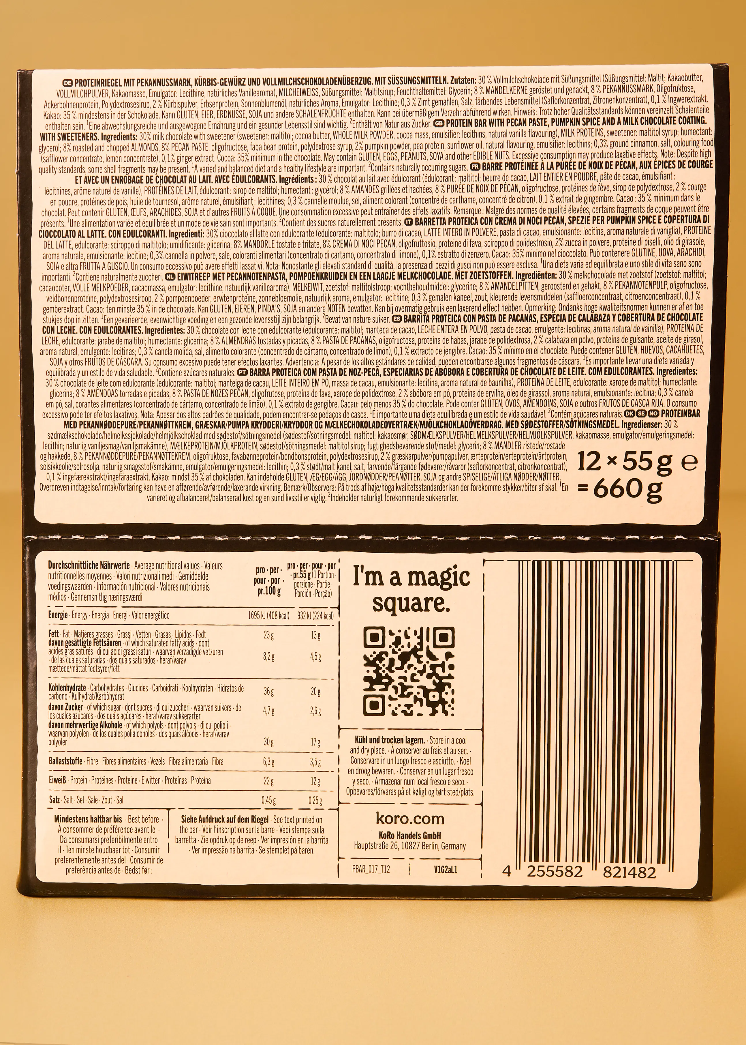 rückseite einer koro proteinriegel-verpackung mit zutatenliste, nährwerttabelle, qr-code und herstellerinformationen.