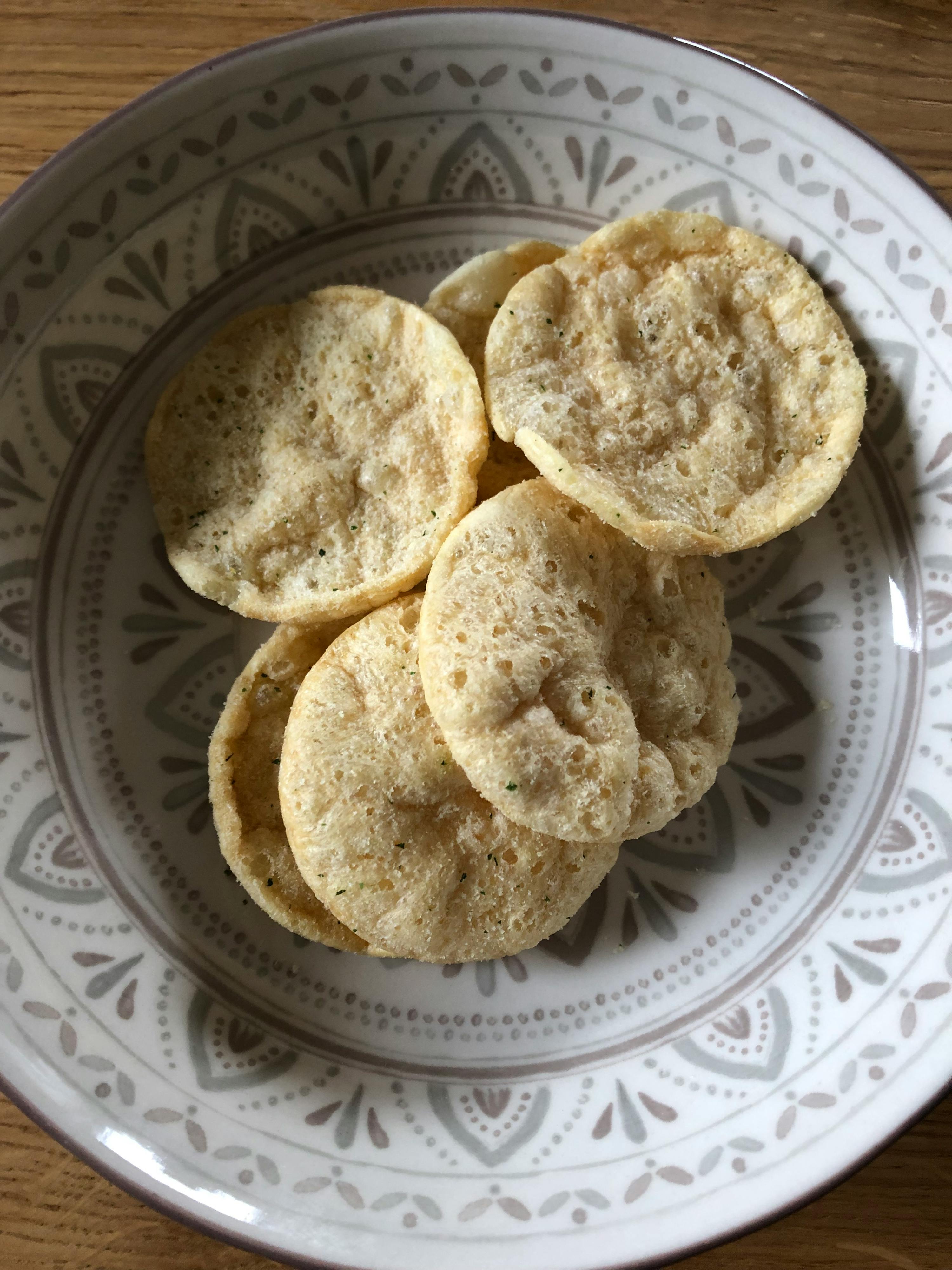 a bowl of crackers with a floral pattern on it