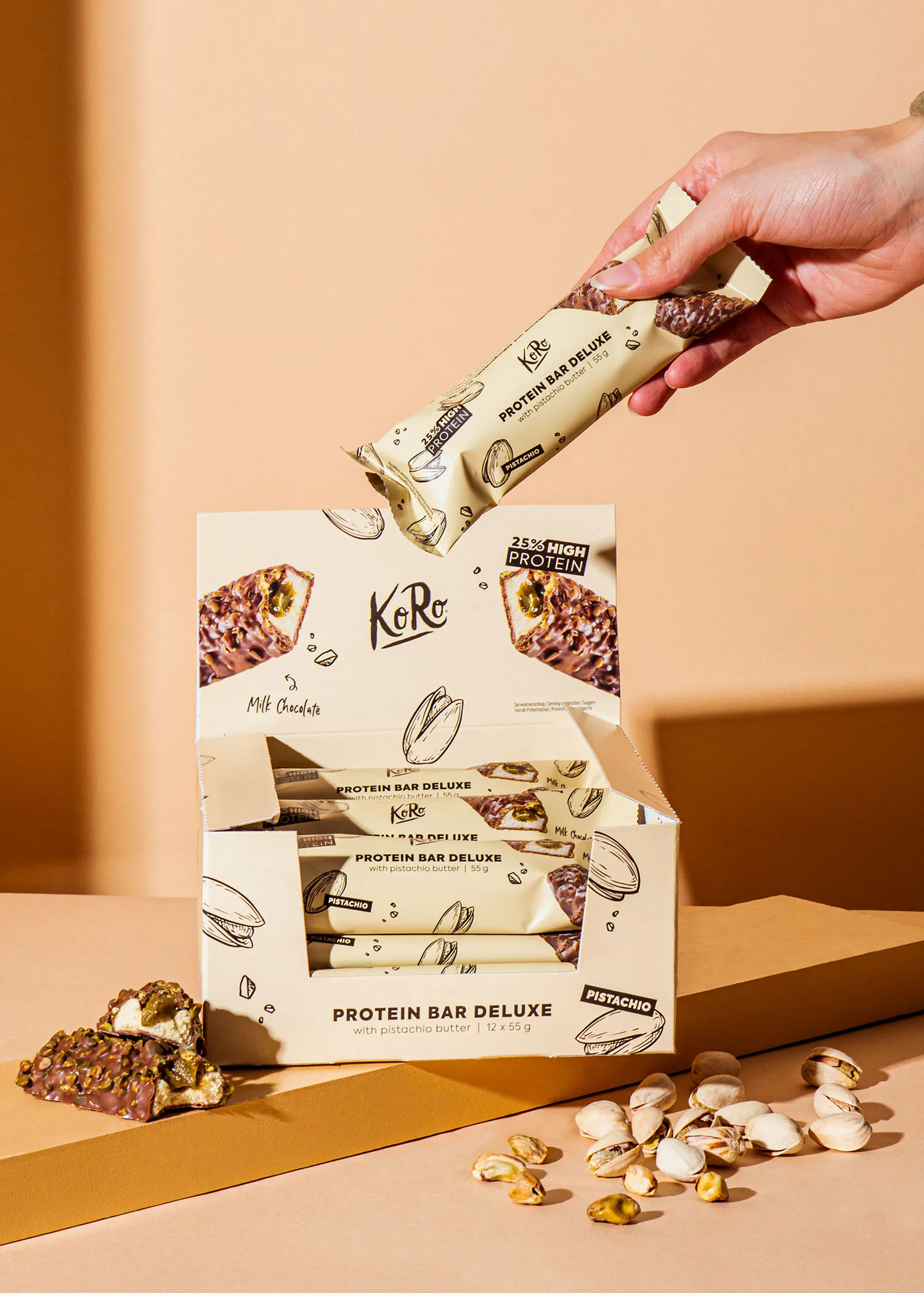 a person is holding a bar that says " protein bar deluxe " on it