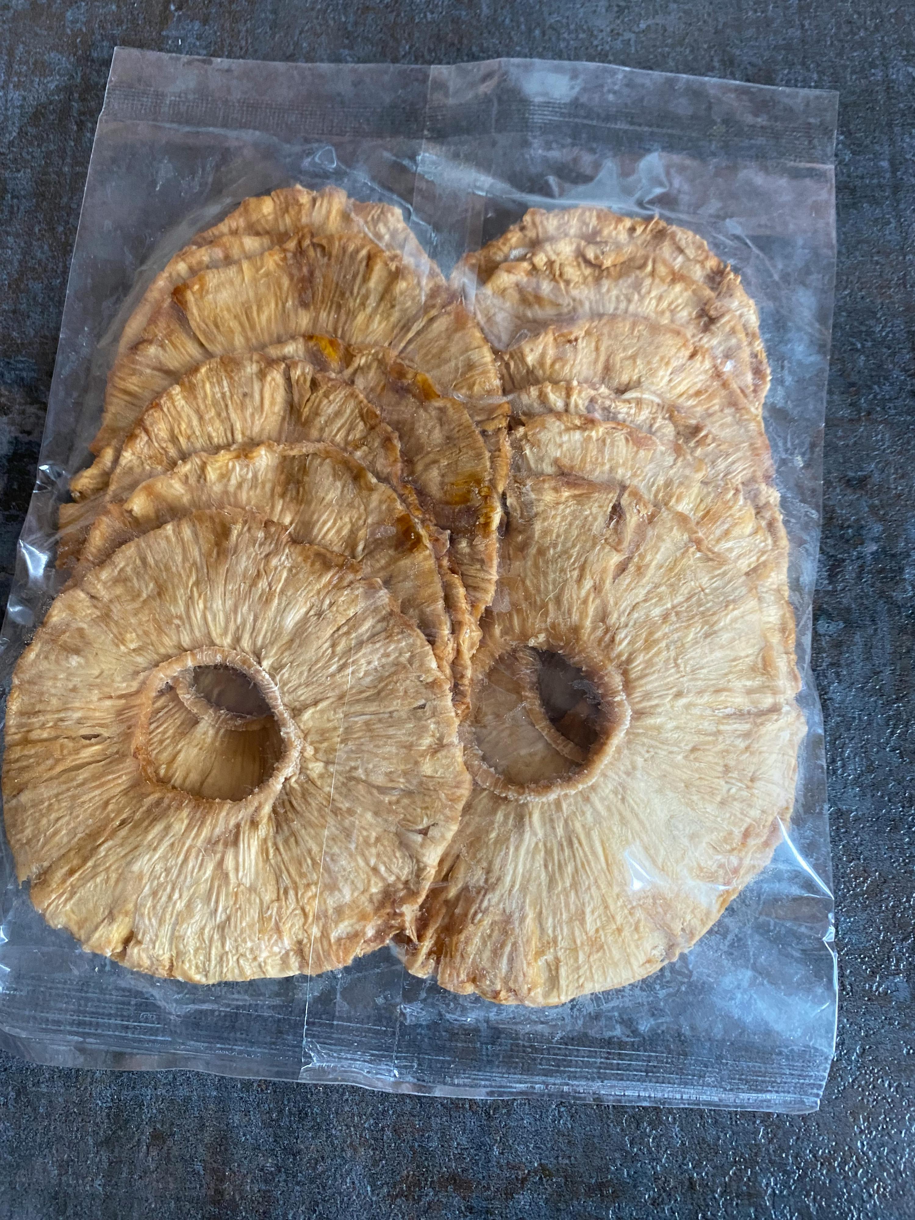 a bag of pineapple slices in a clear plastic bag