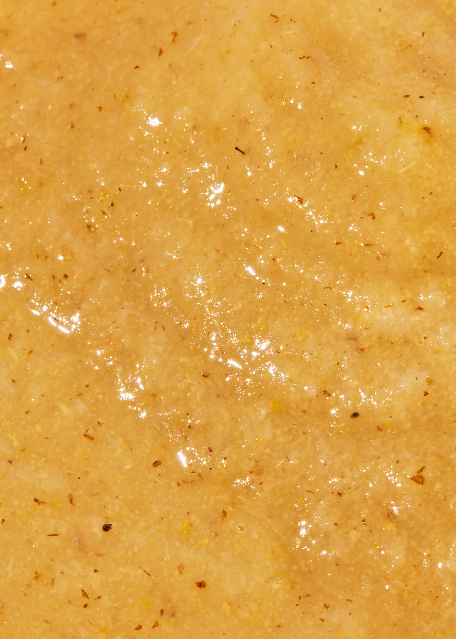 a close up of a brown colored substance with a few small spots on it