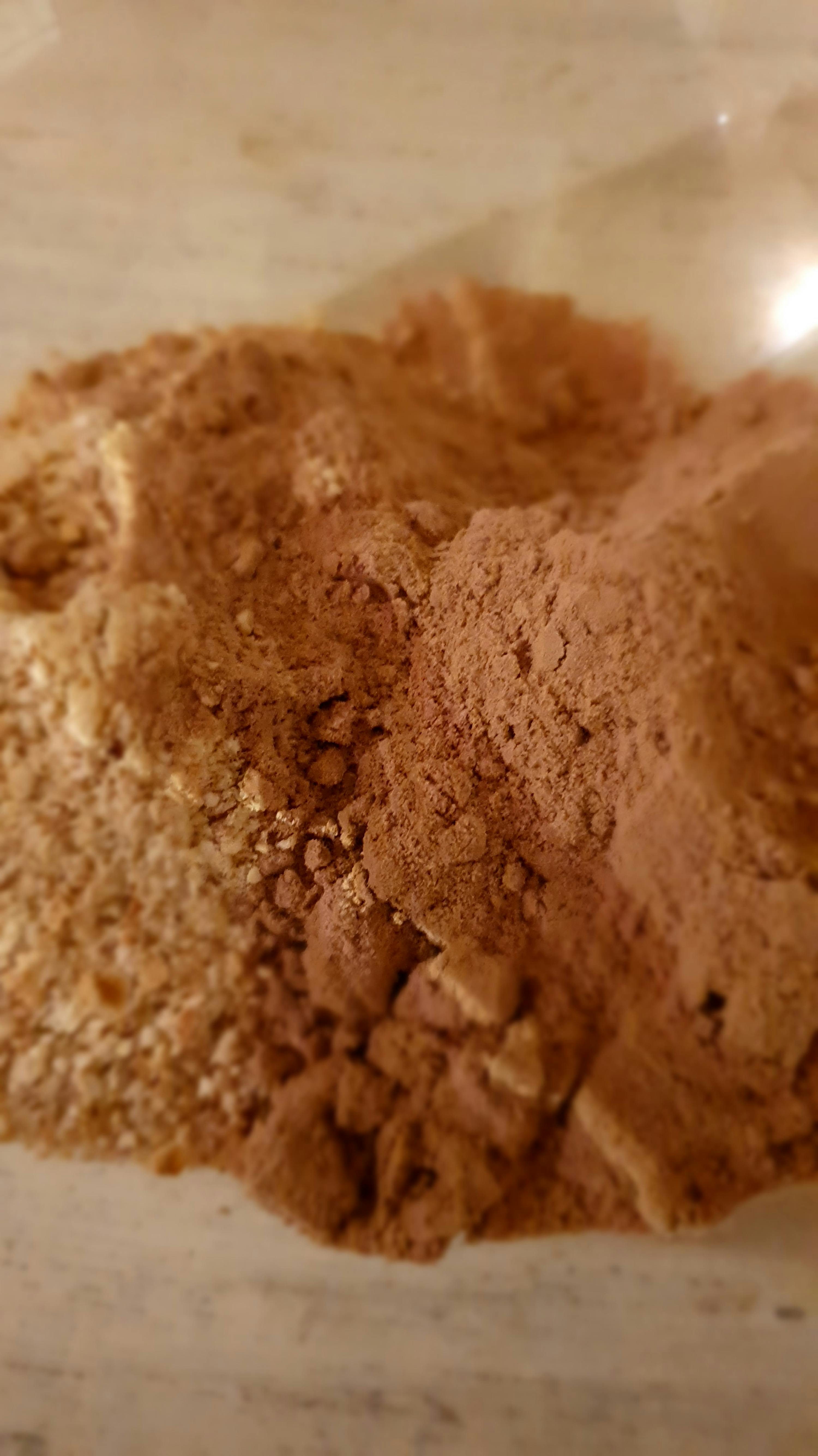 a pile of brown powder is sitting on a table