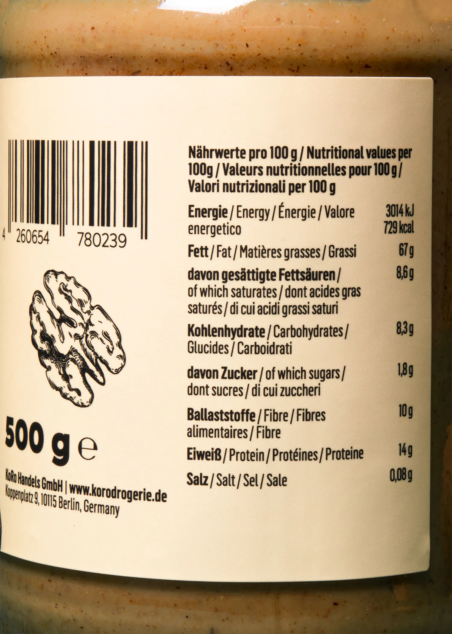 etichetta nutrizionale di un prodotto alimentare con tabella dei valori per 100 grammi, codice a barre, illustrazione di una noce e informazioni sul produttore koro handels gmbh.