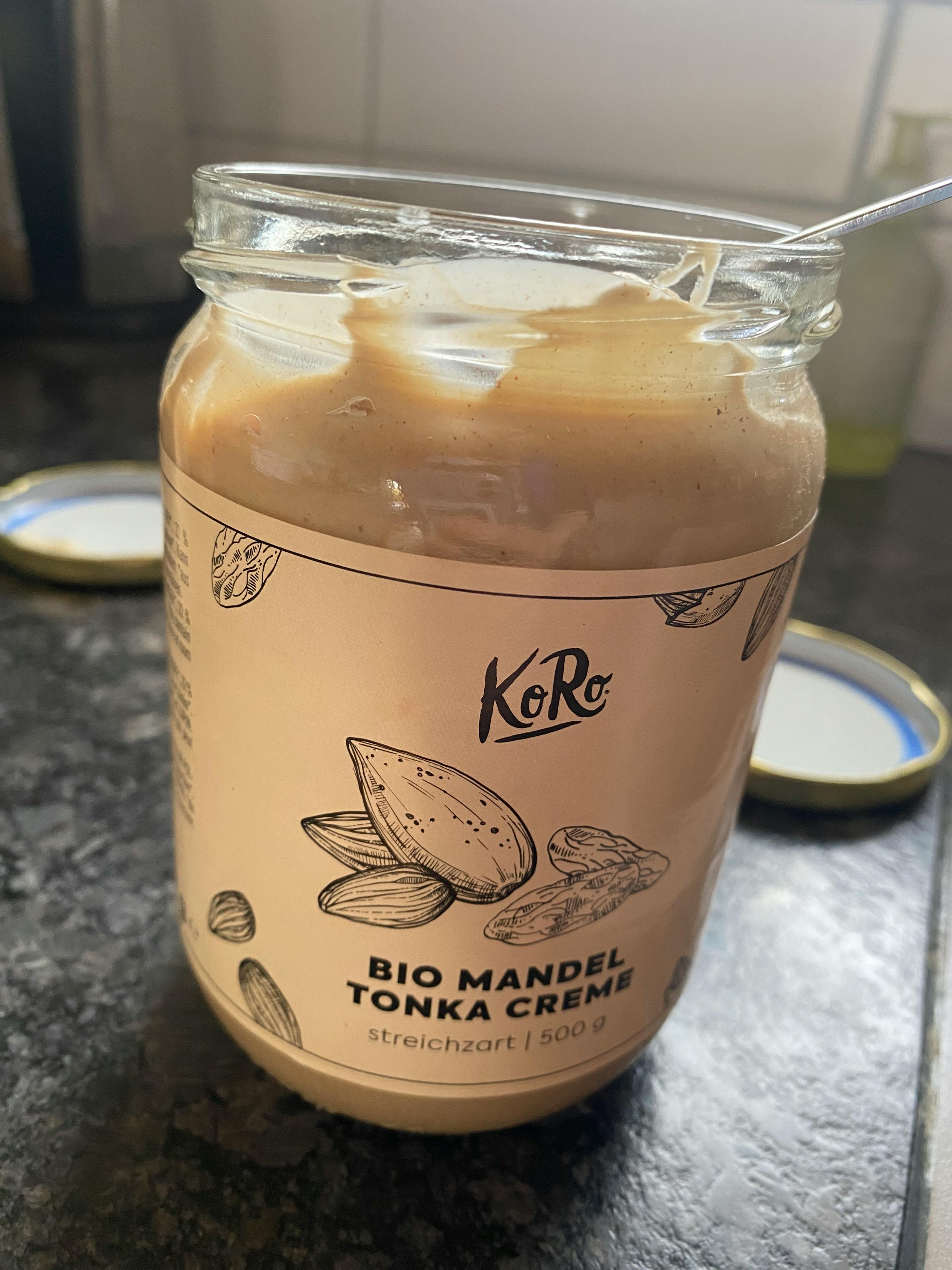 a jar of bio mandel tonka creme sits on a counter