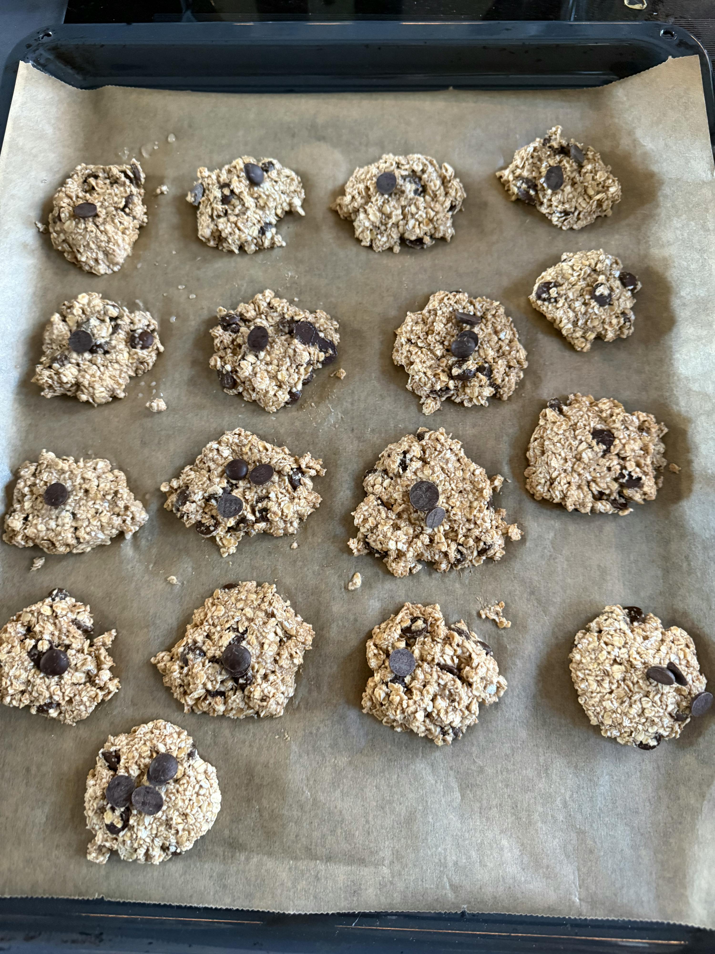 a tray of cookies with chocolate chips on them