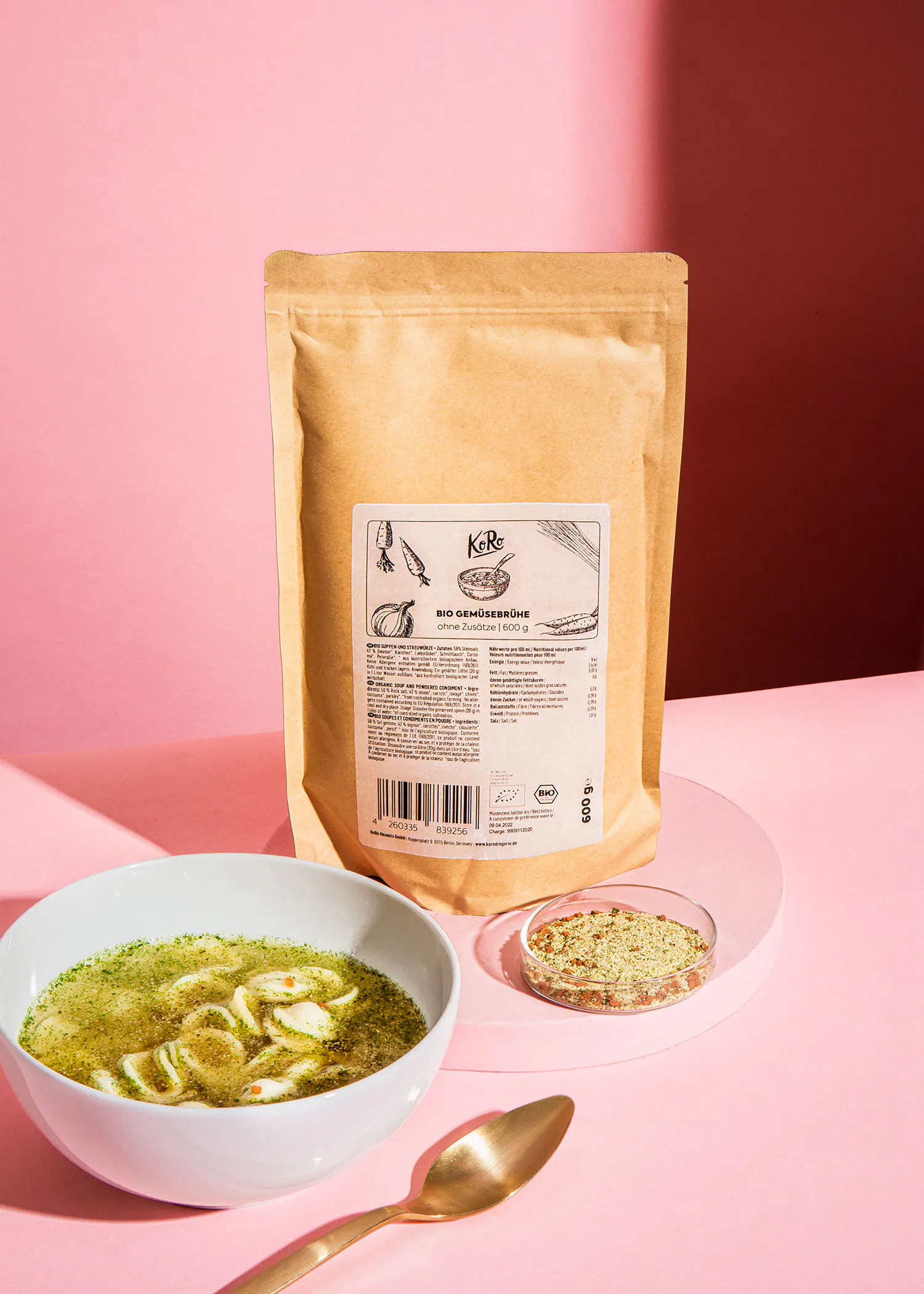 a bowl of soup next to a bag that says kelle