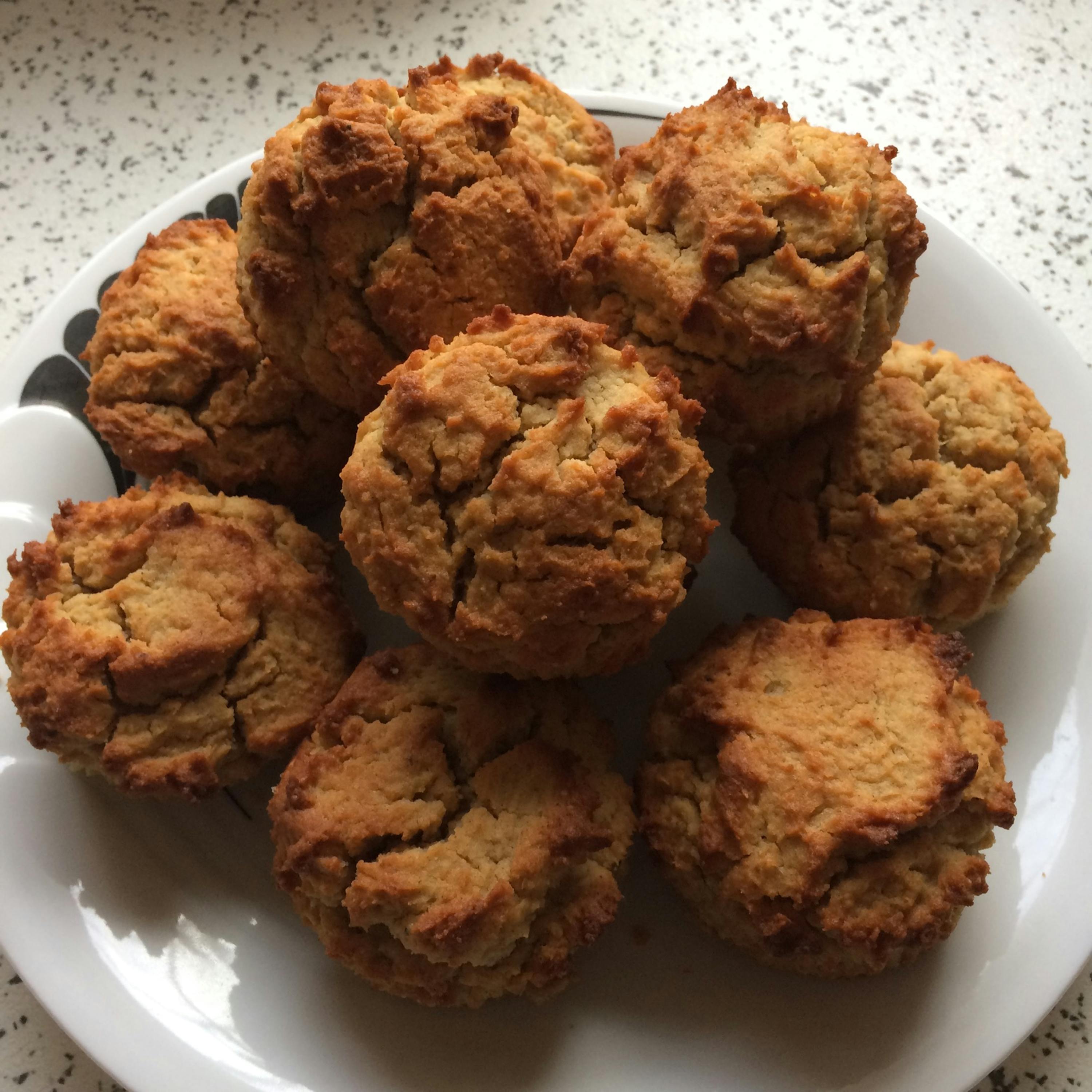 a white plate topped with a bunch of brown cookies