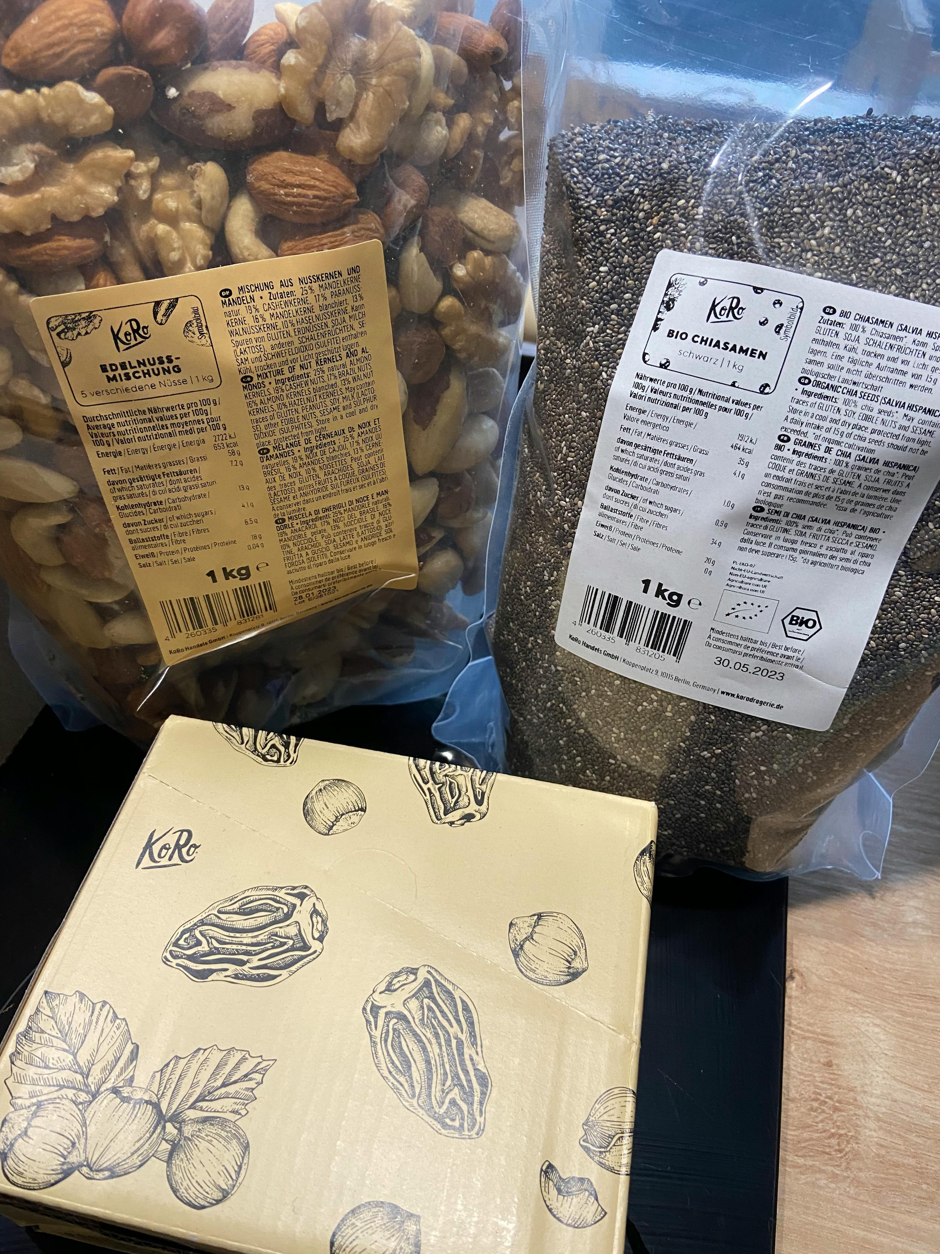 a box of nuts sits next to a bag of chia seeds