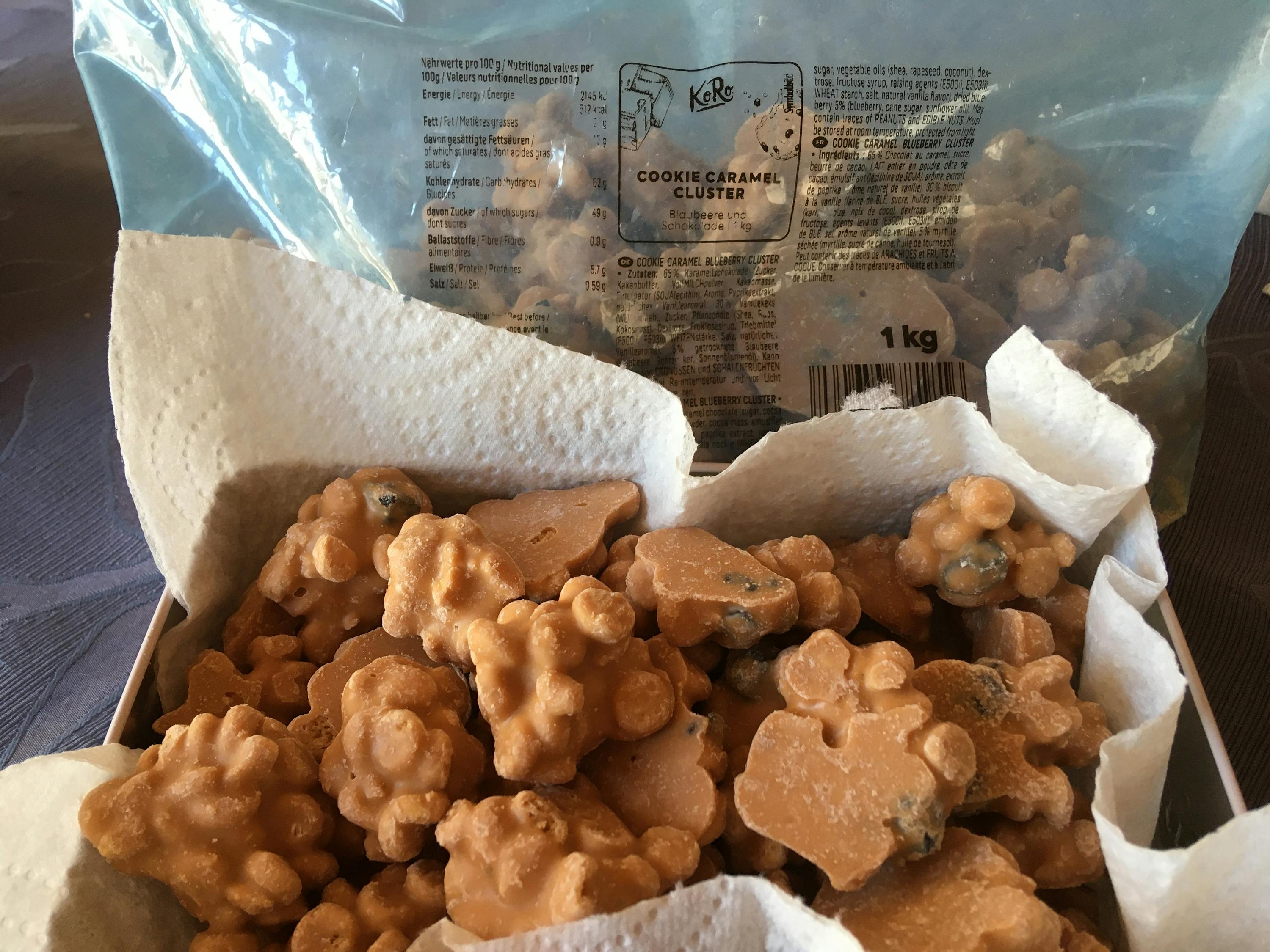 a bag of cookie caramel clusters sits on a napkin