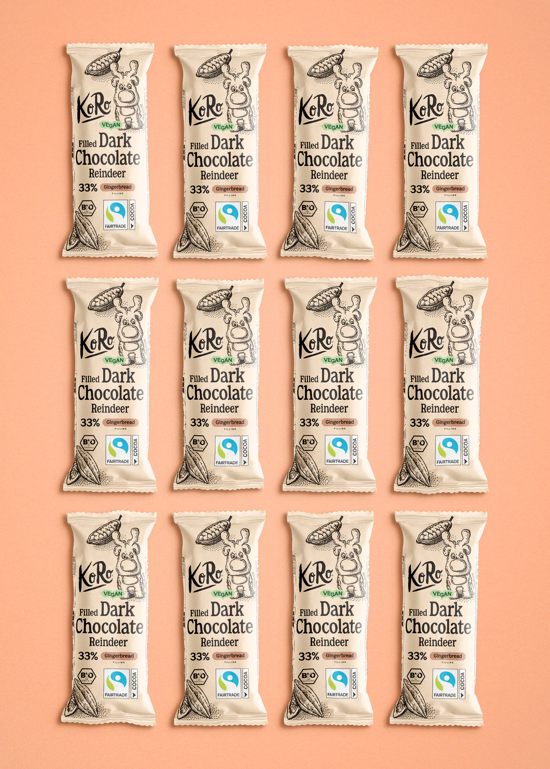 twelve identical koro vegan filled dark chocolate reindeer bars with gingerbread filling arranged in a grid on a peach background.
