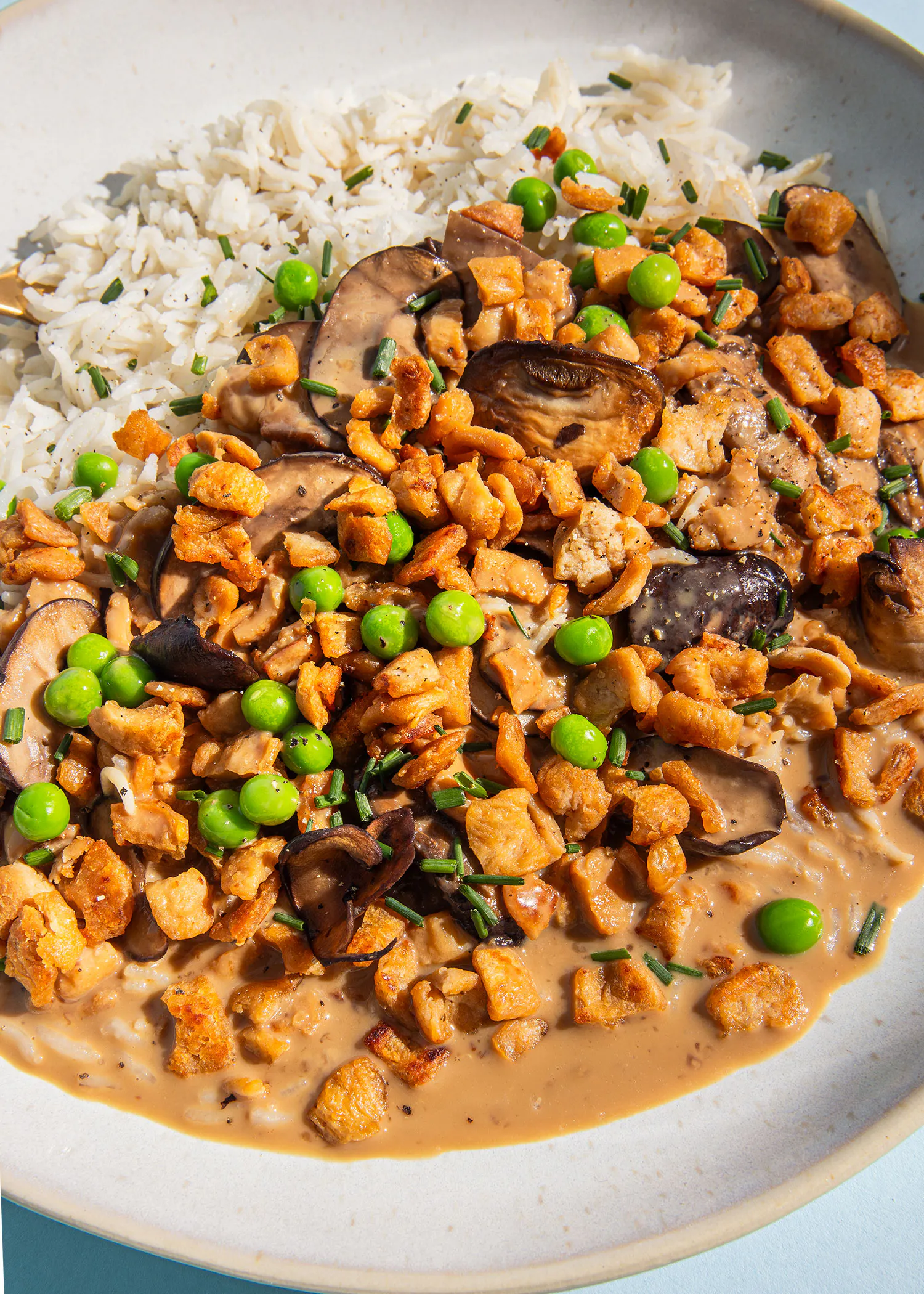 a close up of a plate of food with rice and vegetables