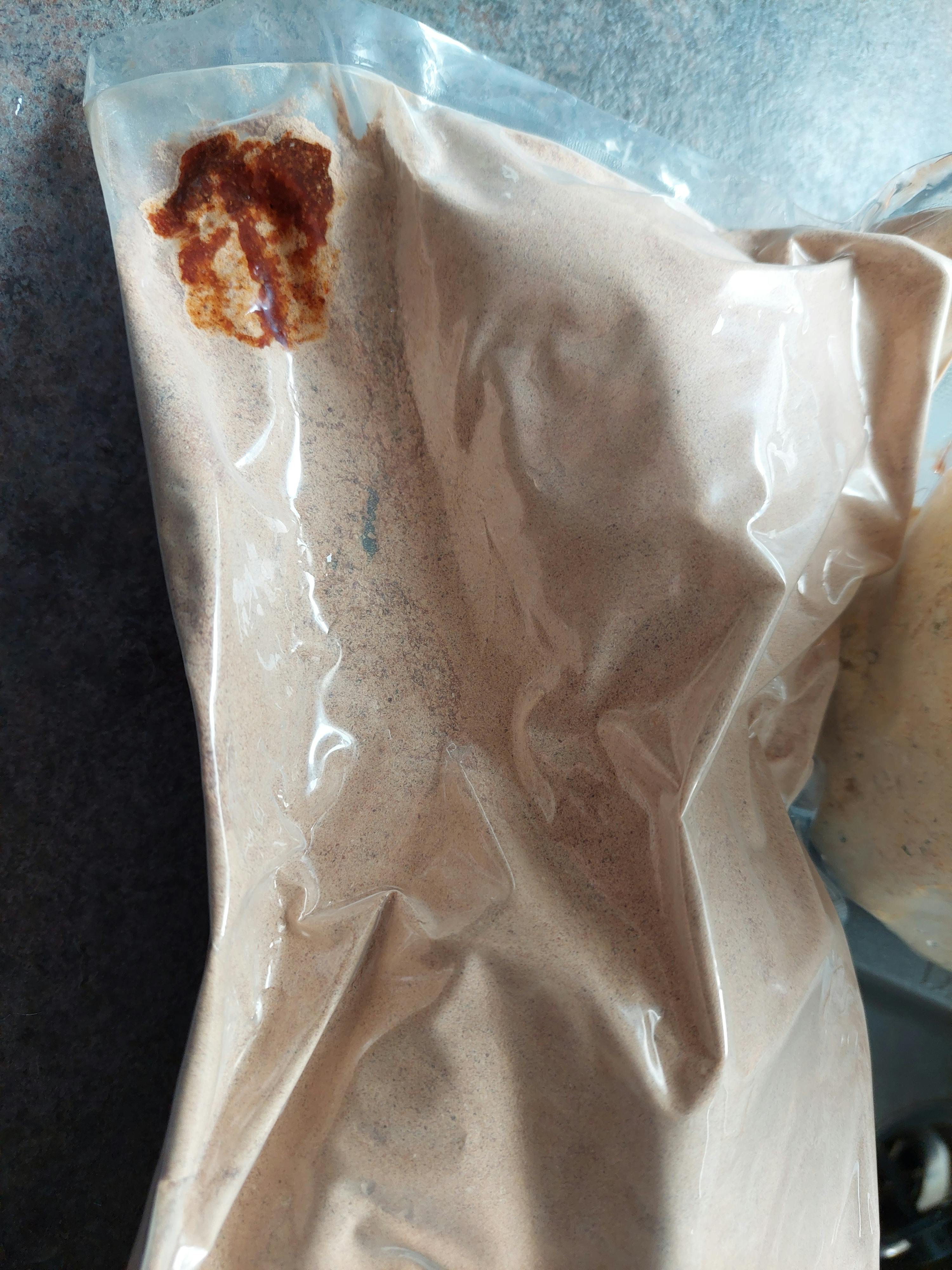a plastic bag with a brown substance inside of it