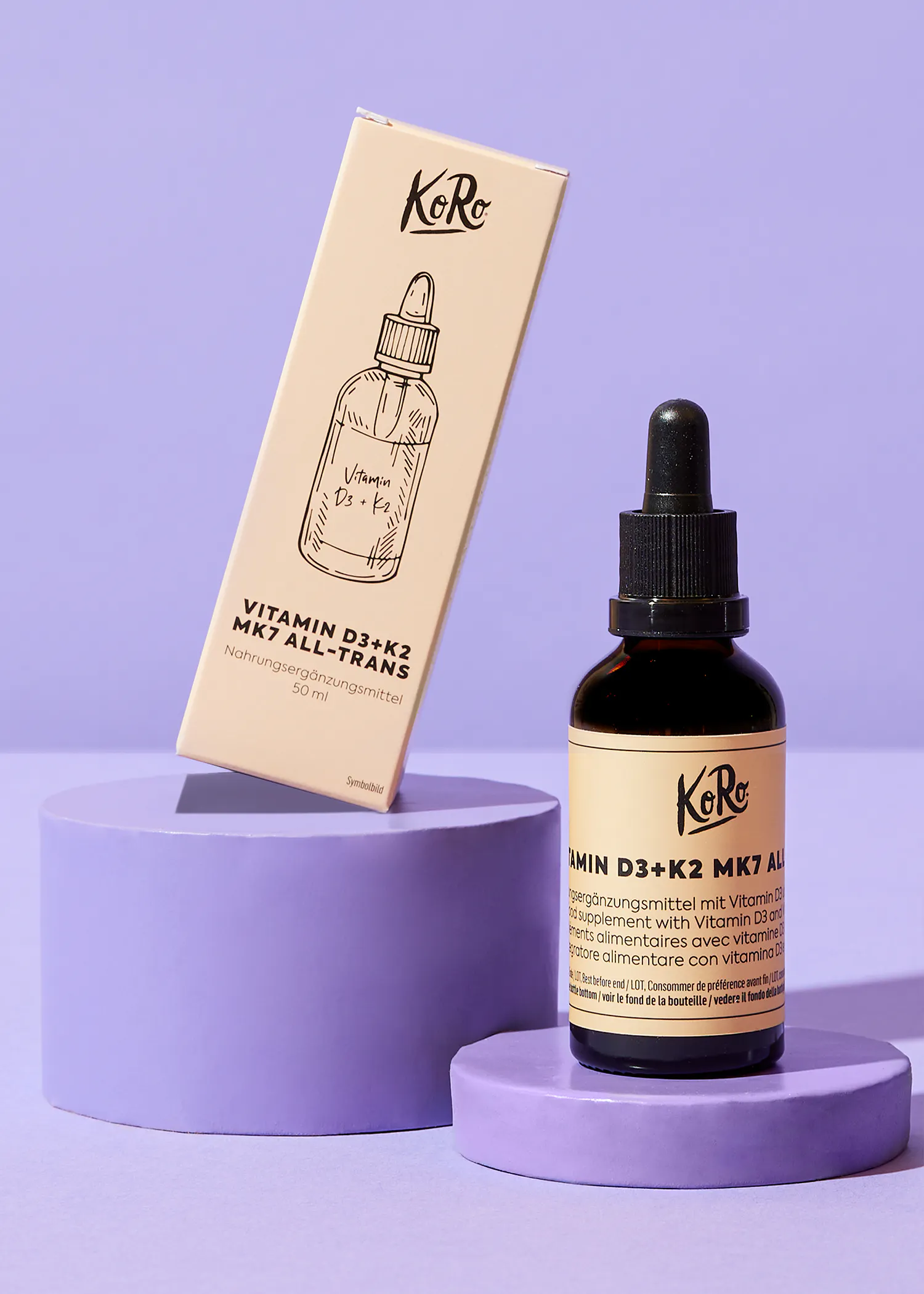 a bottle of koro vitamin d3 + k2 mk7 al sits next to its box