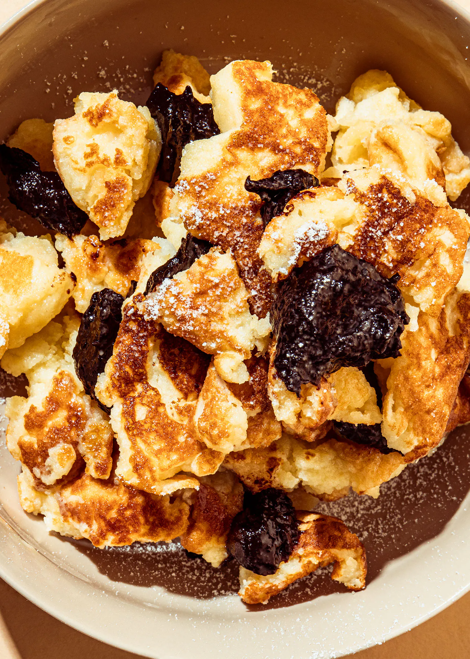 a bowl of food with powdered sugar on top