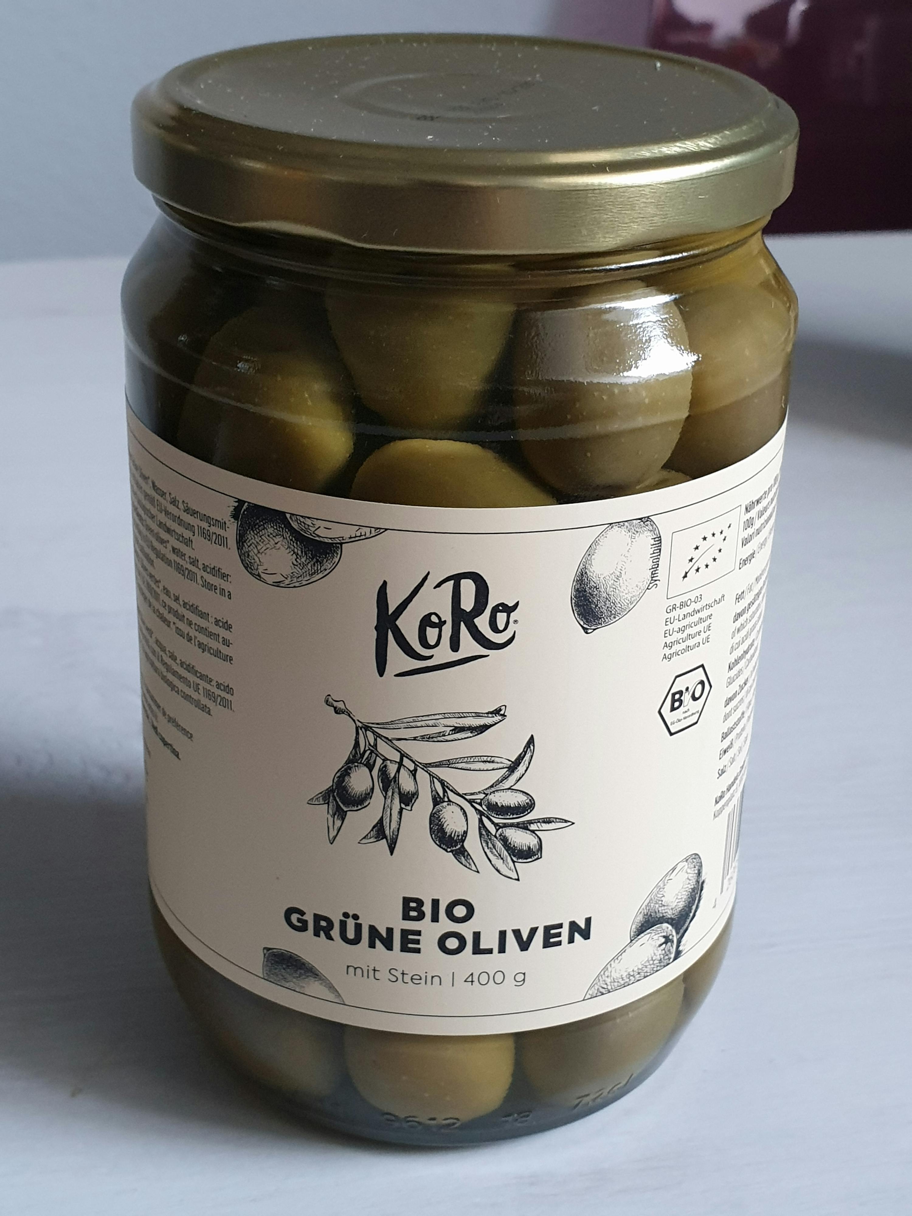 a jar of green olives has a label that says bio grune oliven
