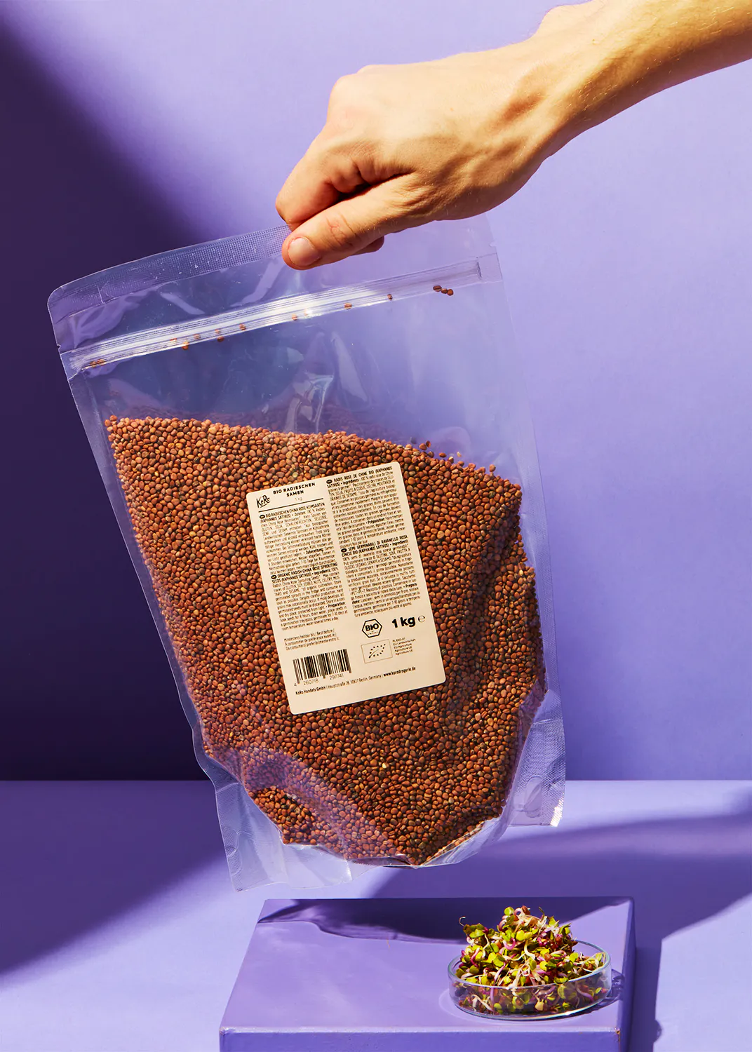 a person is holding a bag of food that says 1 kg on it