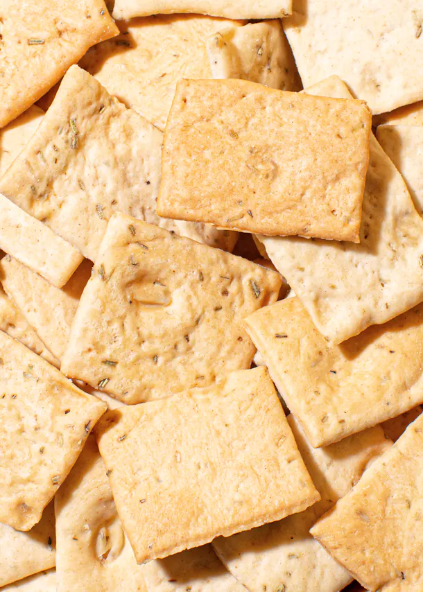 a pile of crackers with a few pieces missing