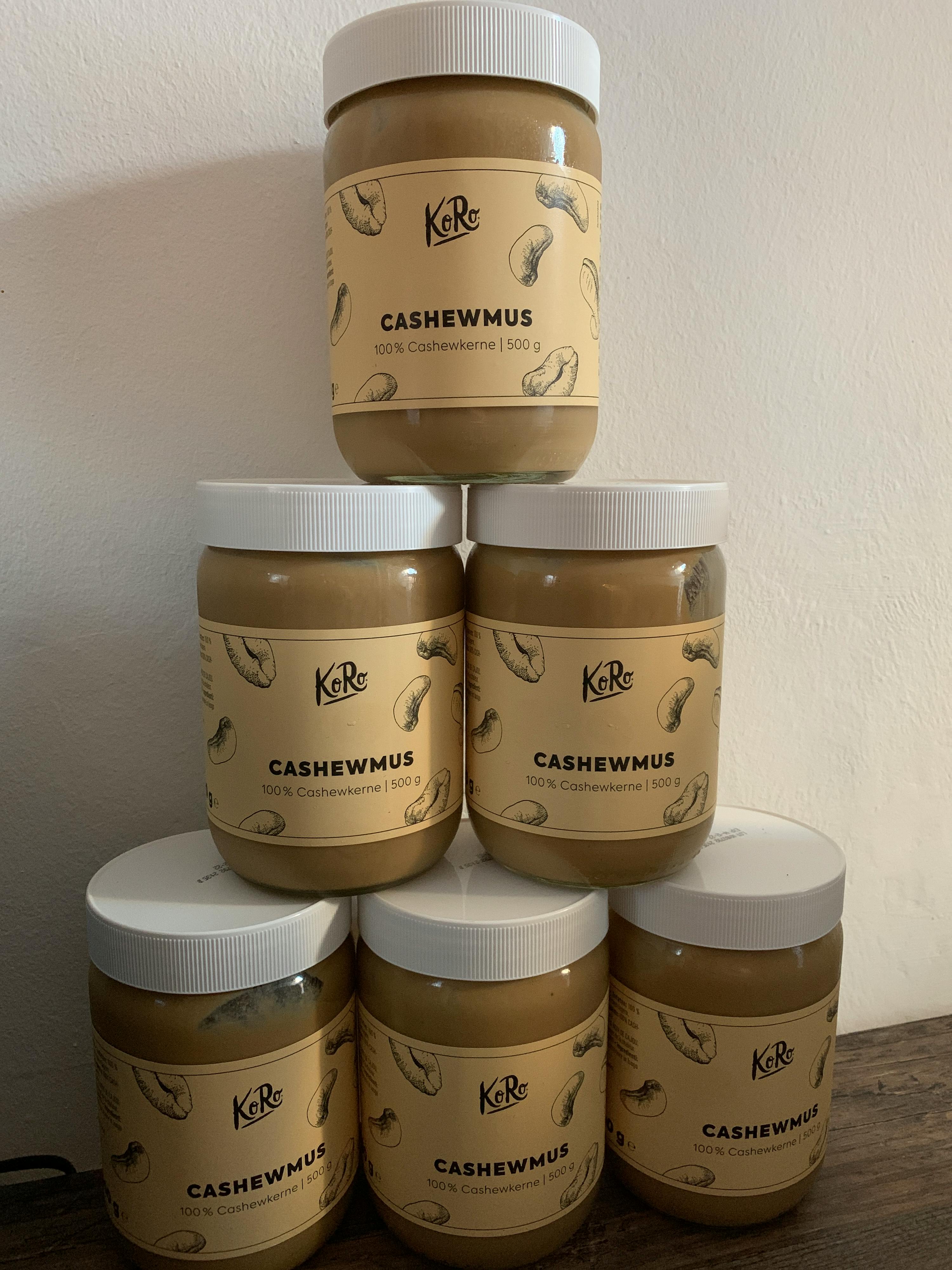 several jars of cashewmus are stacked on top of each other
