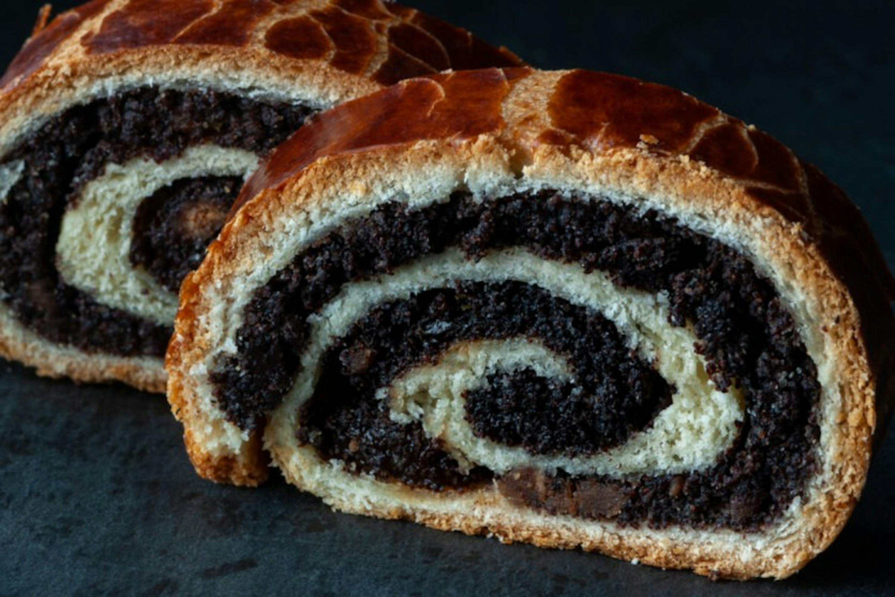 two slices of chocolate bread with a white swirl in the middle