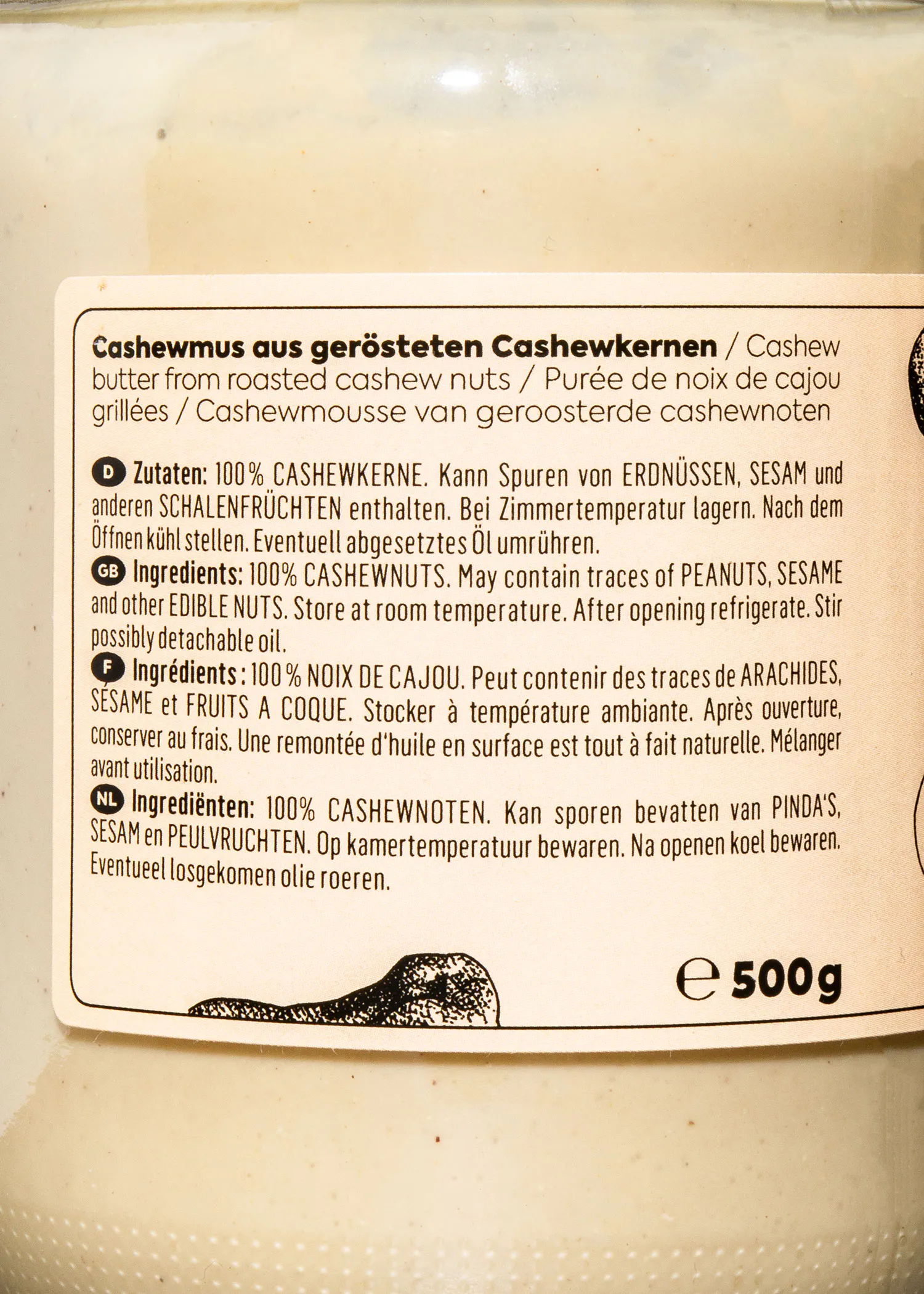 a jar of cashew butter has a label that says cashewmus aus gerosteten cashewkernen