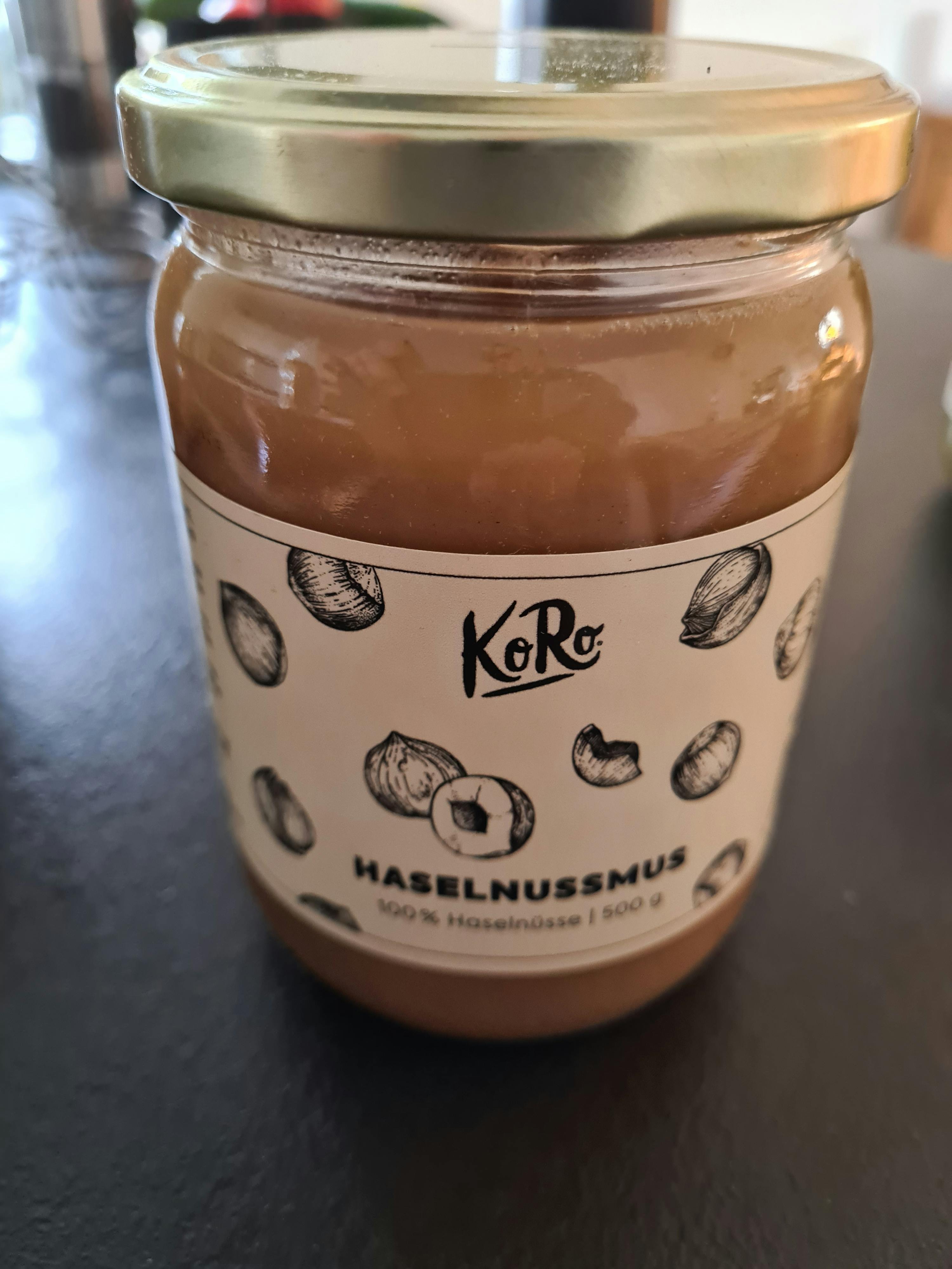 a jar of haselnussnus has a white label with nuts on it