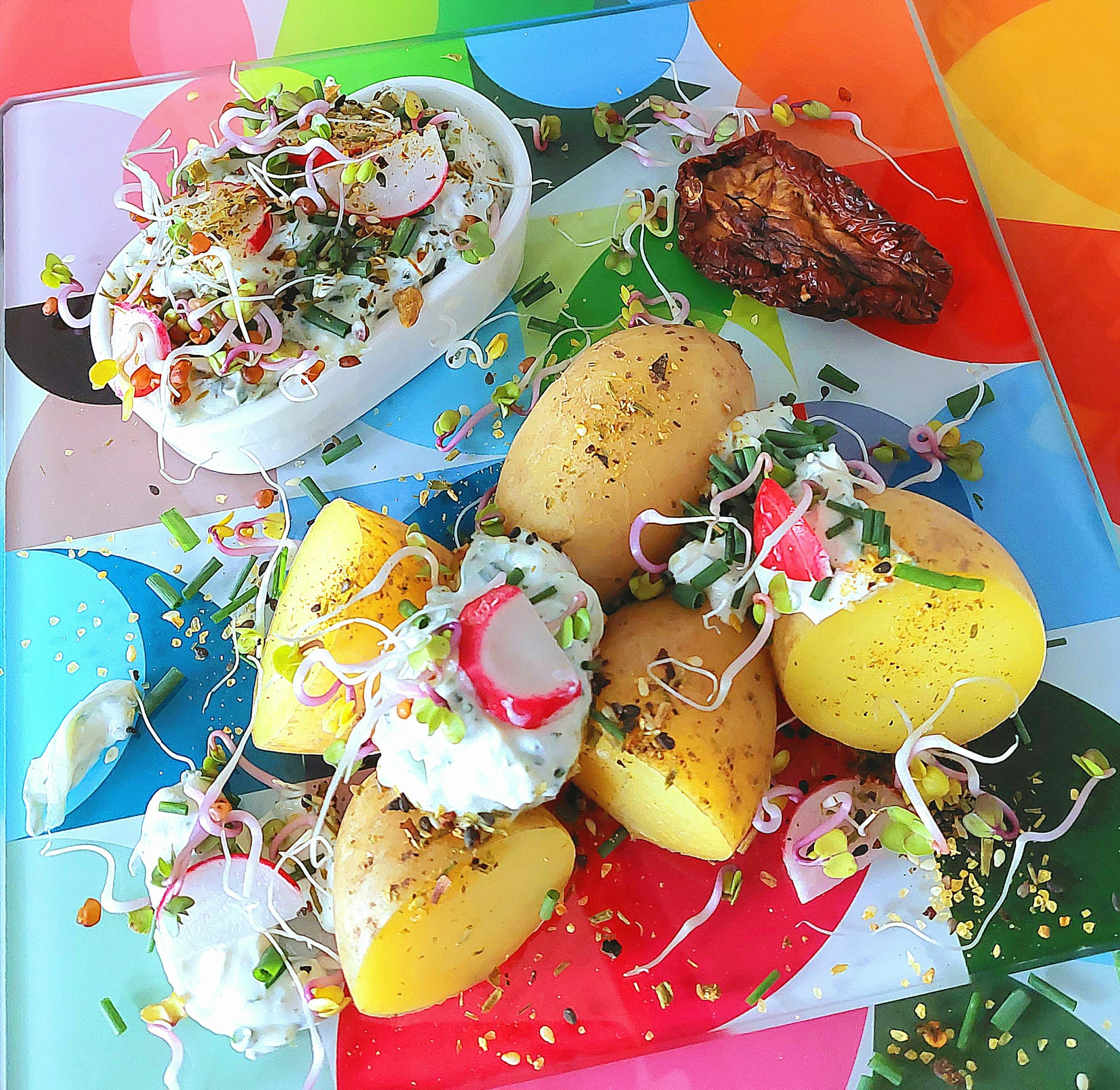 a plate of food with potatoes radishes and other vegetables