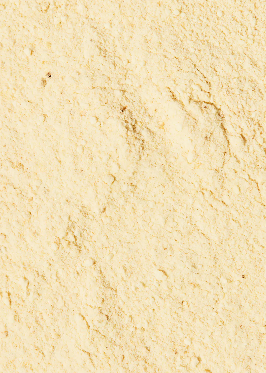 un gros plan d' un tas de farine jaune