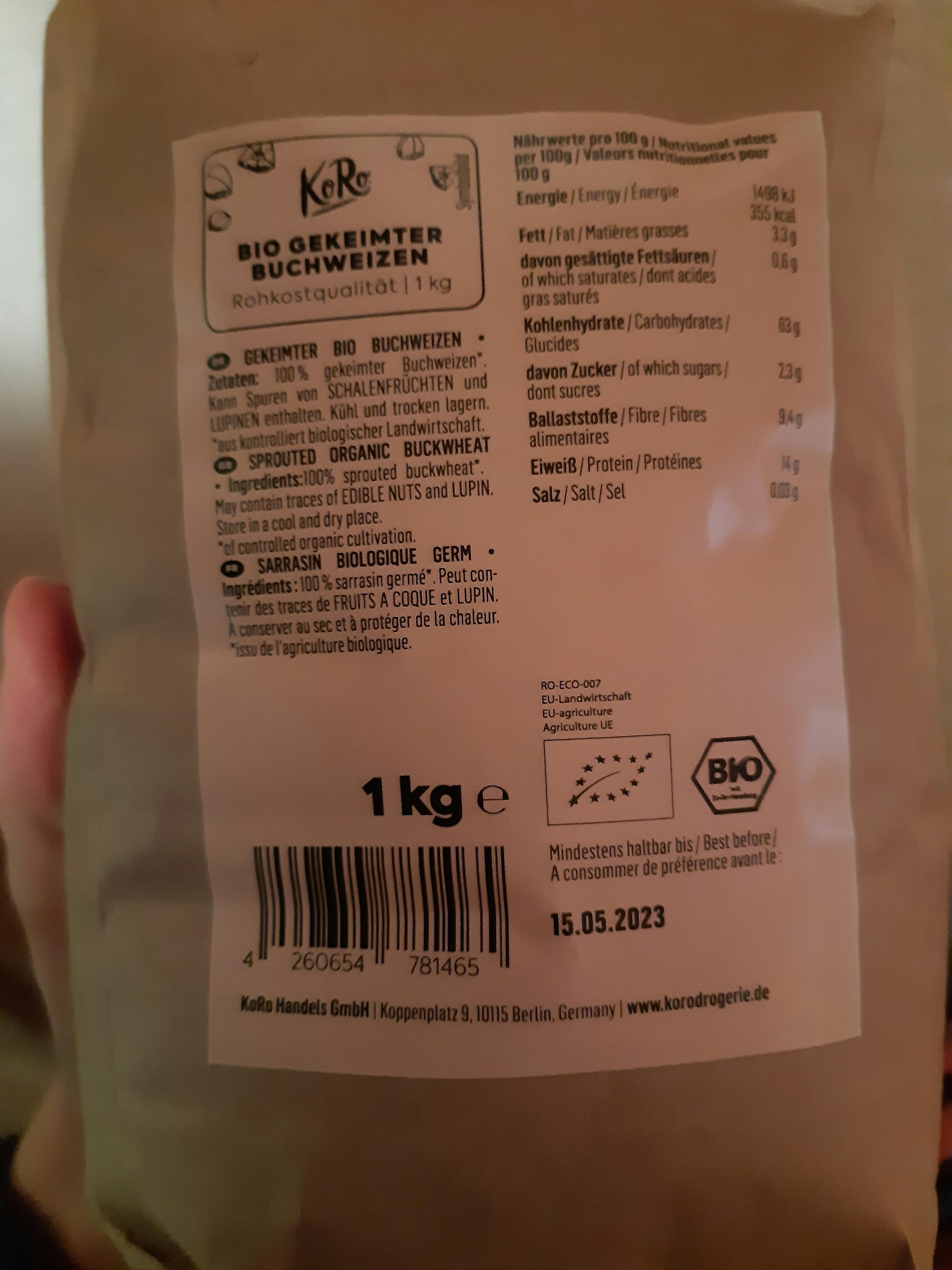 a person is holding a bag of bio sprouted wheat