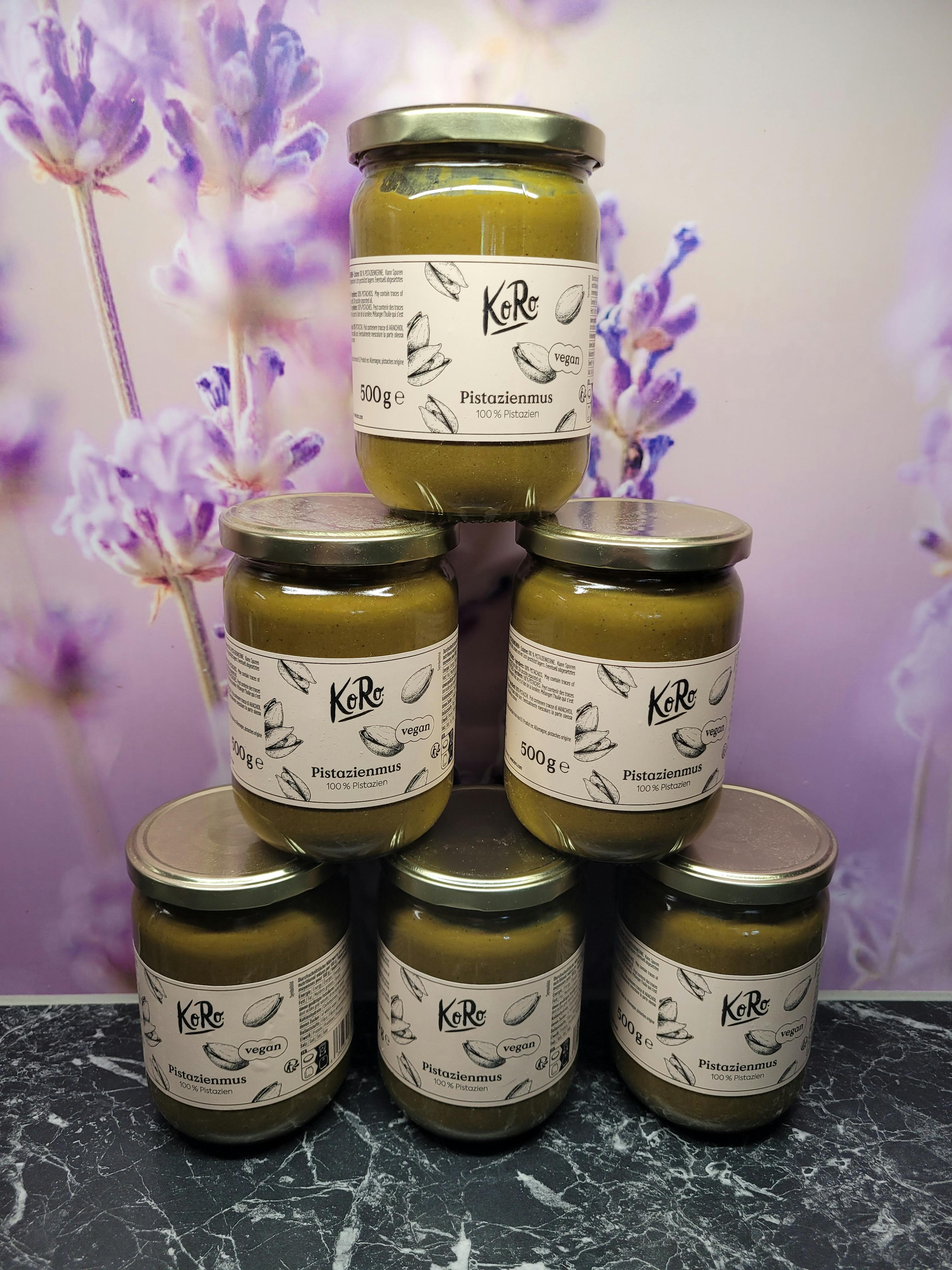 a stack of jars with labels that say " kare " on them