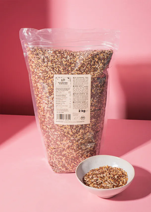 a bag of rice is next to a bowl of rice