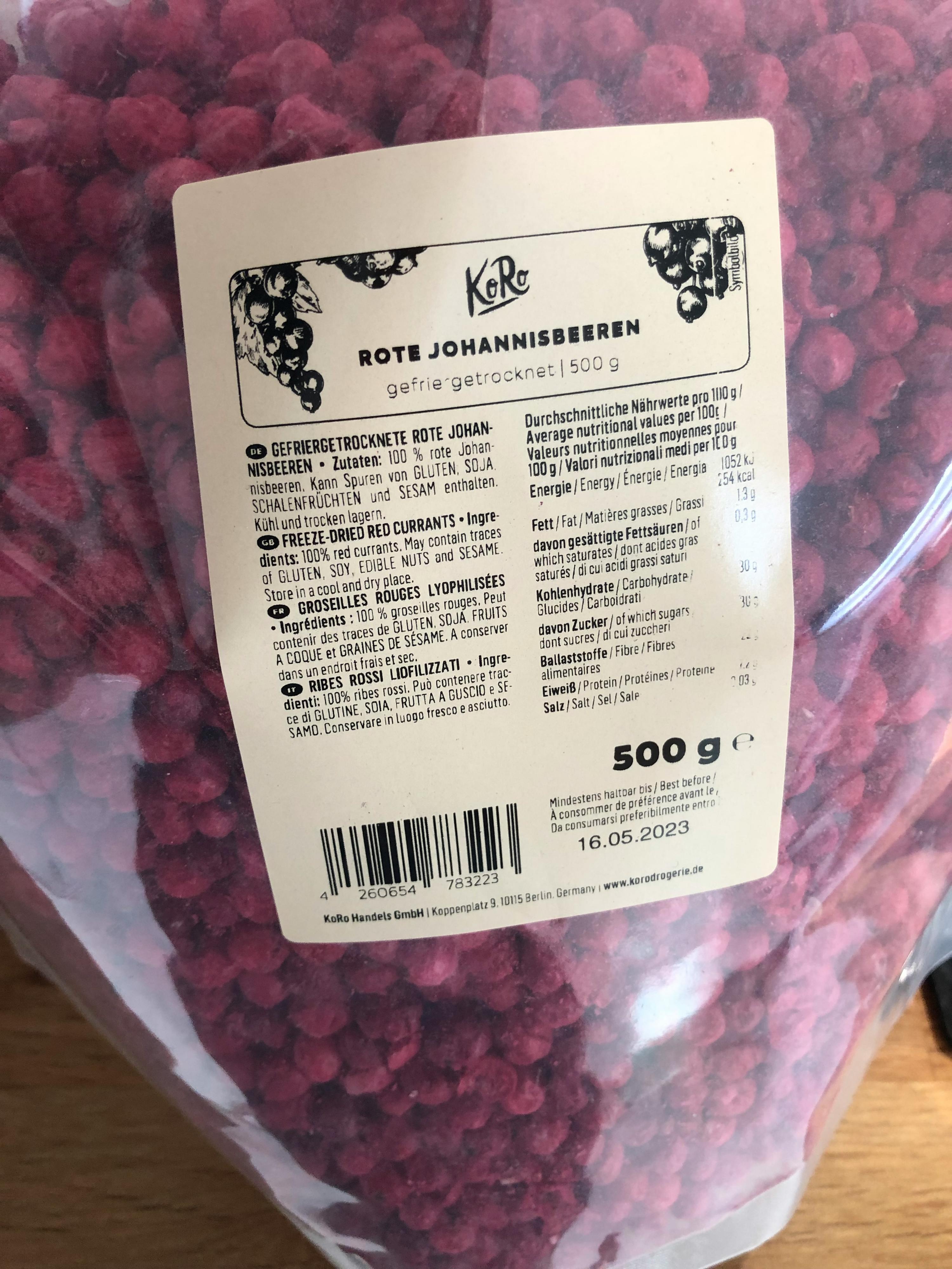 a bag of rote johannisbeeren sitting on a wooden table