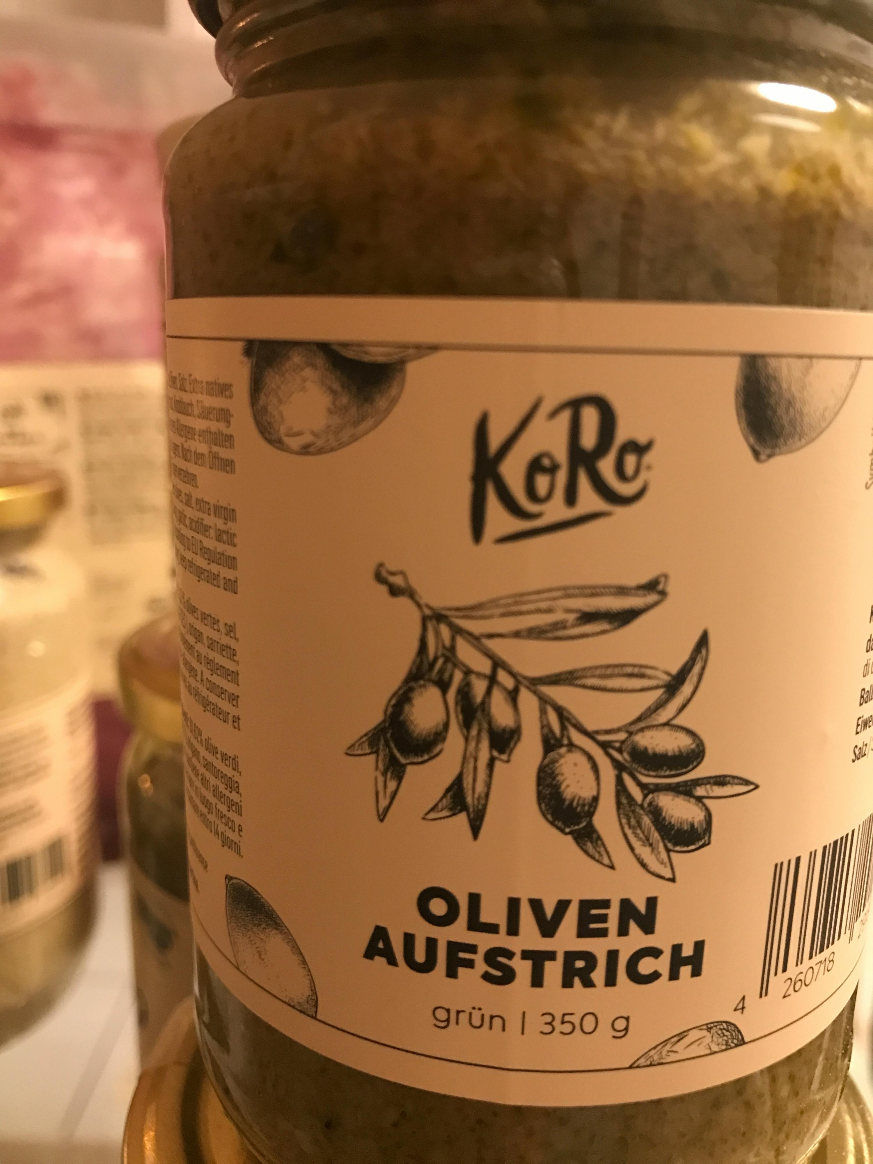 a jar of olives has a label that says oliven aufstrich