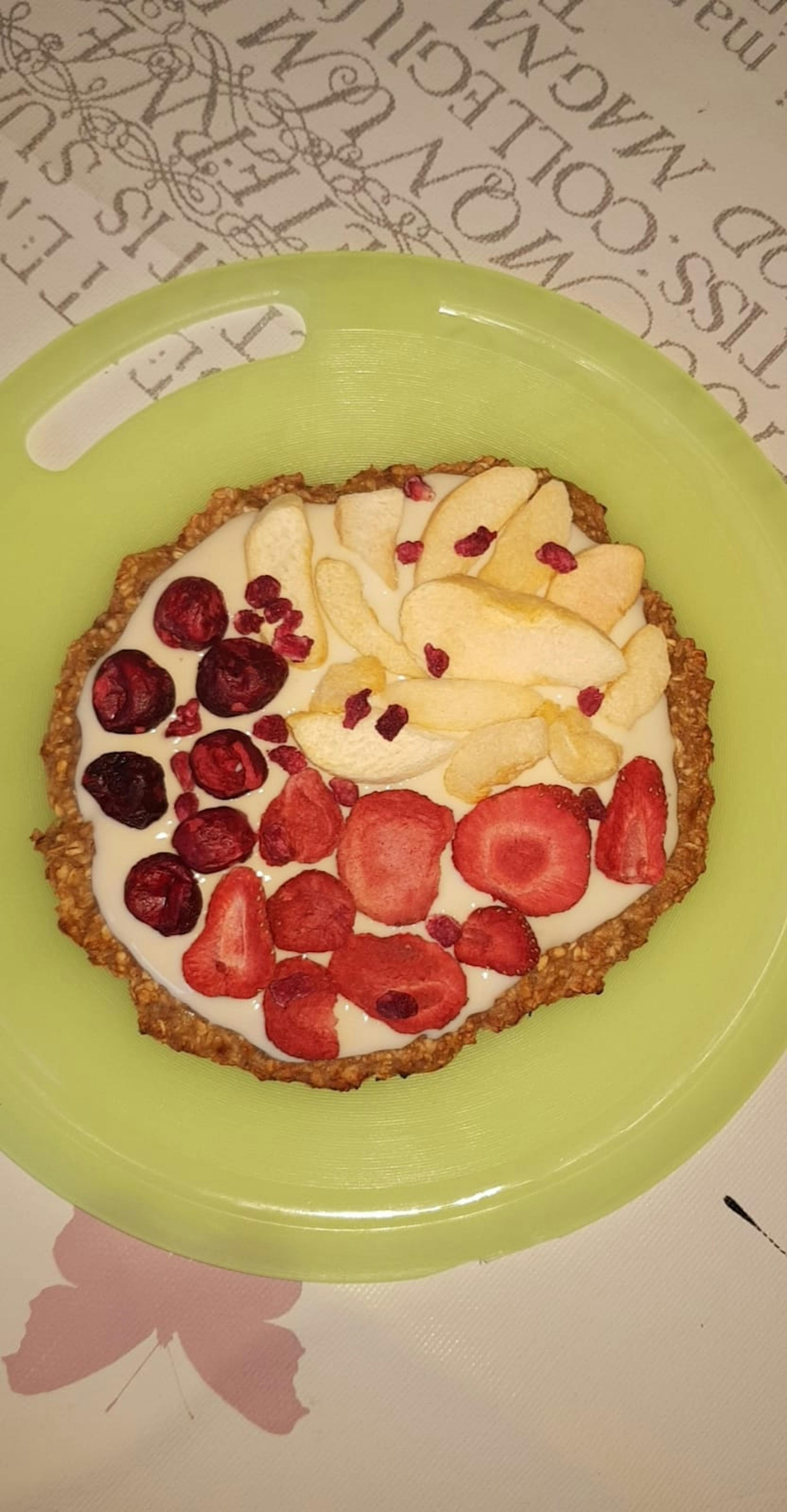 a plate of food with strawberries apples and cranberries on it