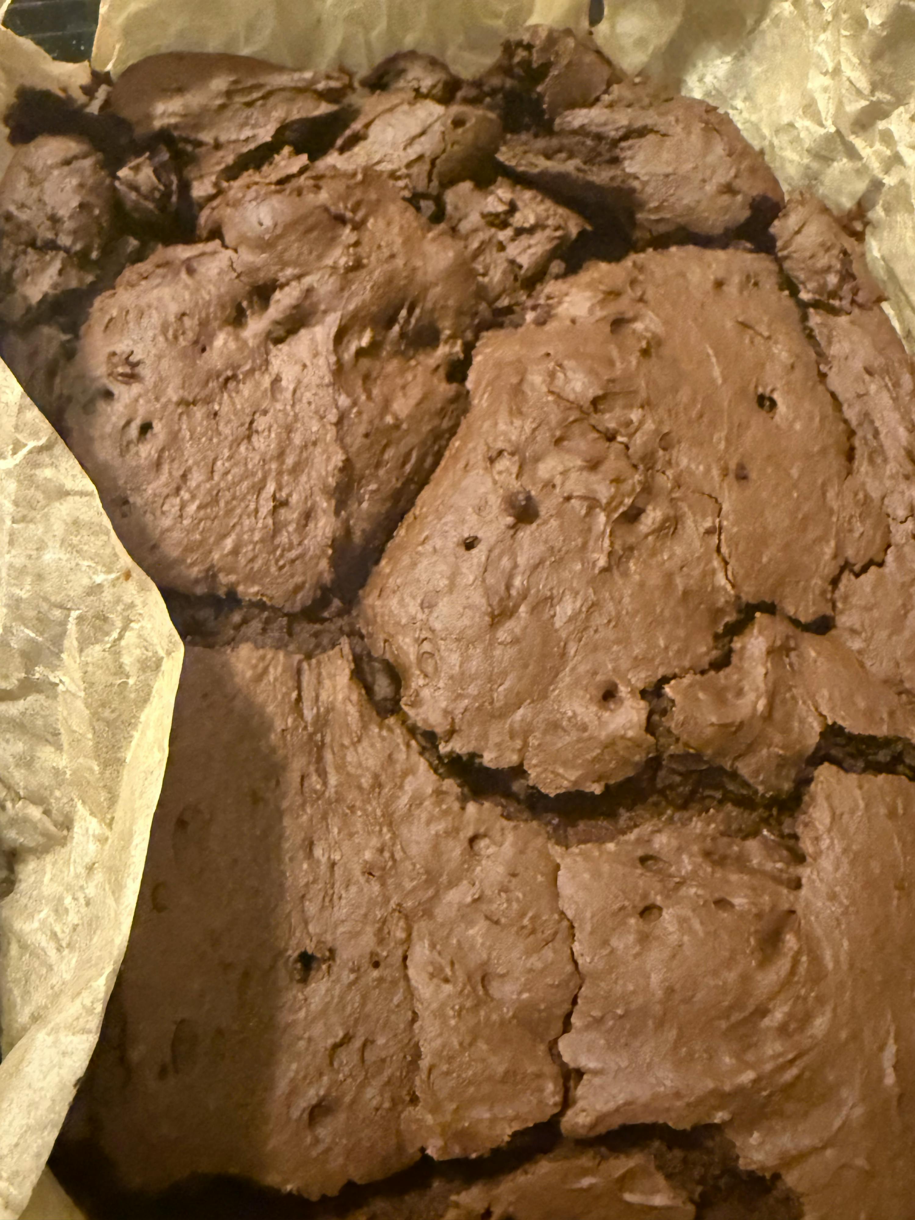 a close up of a brownie on a piece of paper