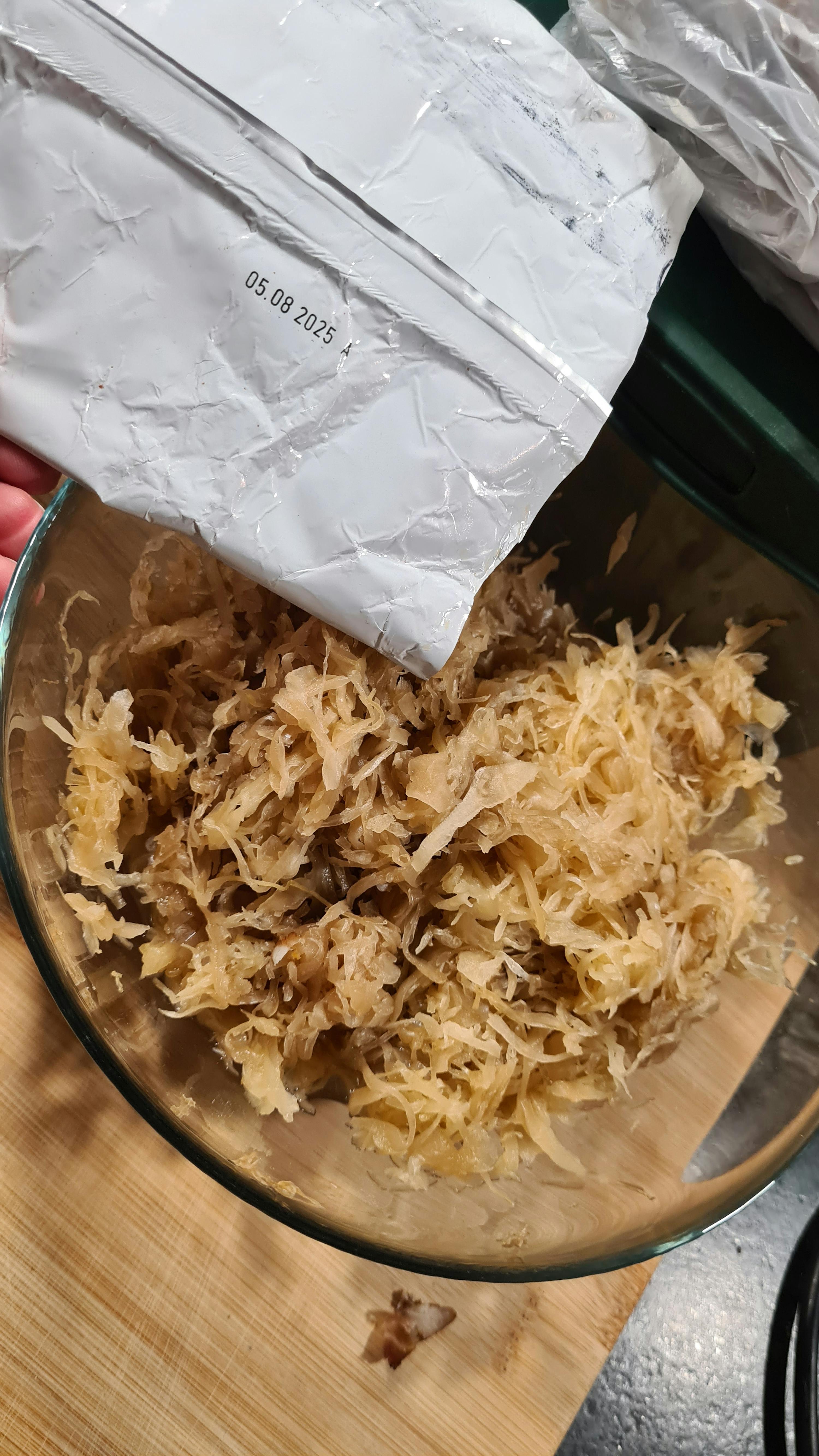 a bag of shredded cabbage has a date of 05/08/2021 on it