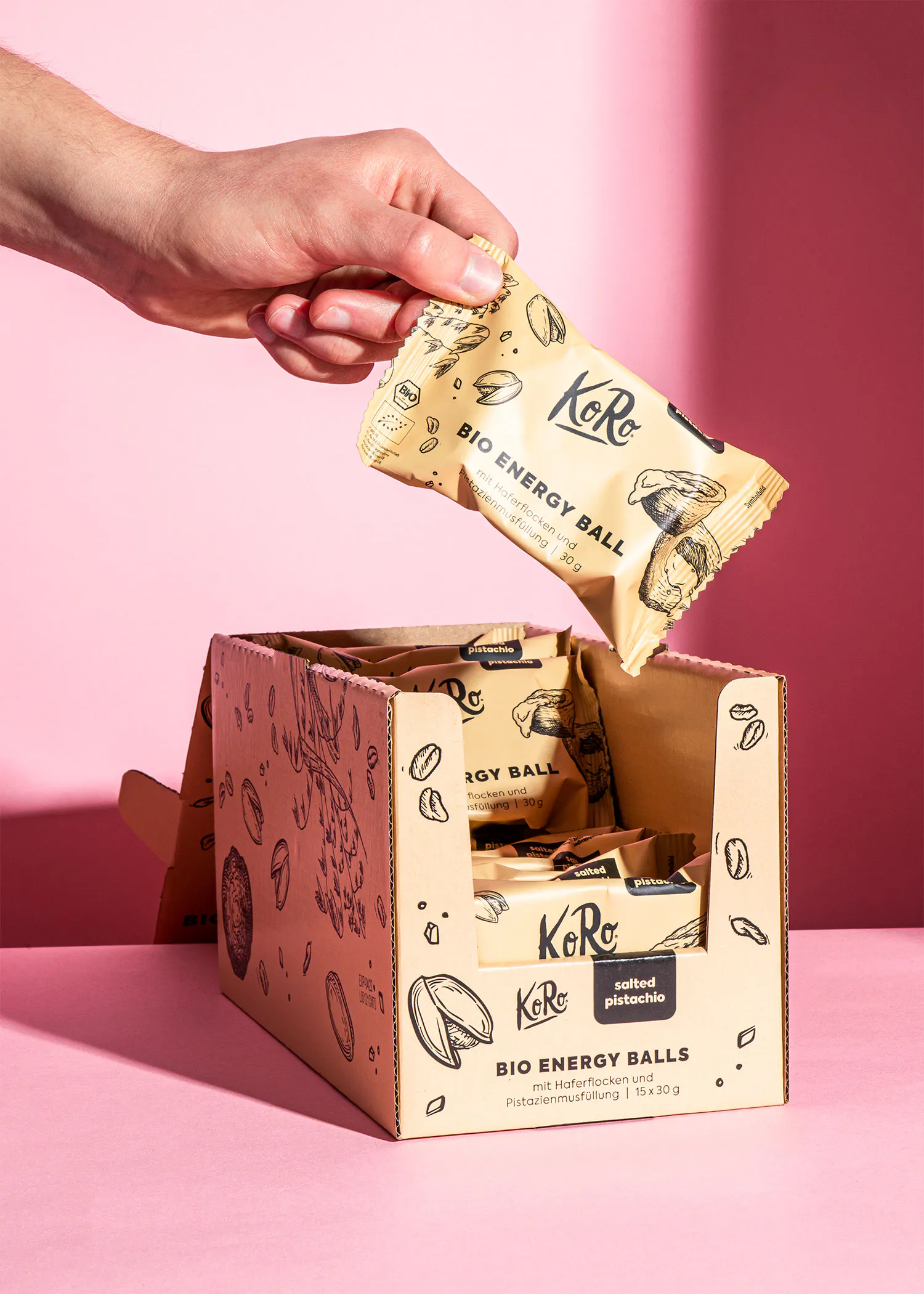 a person is holding a package of bio energy balls