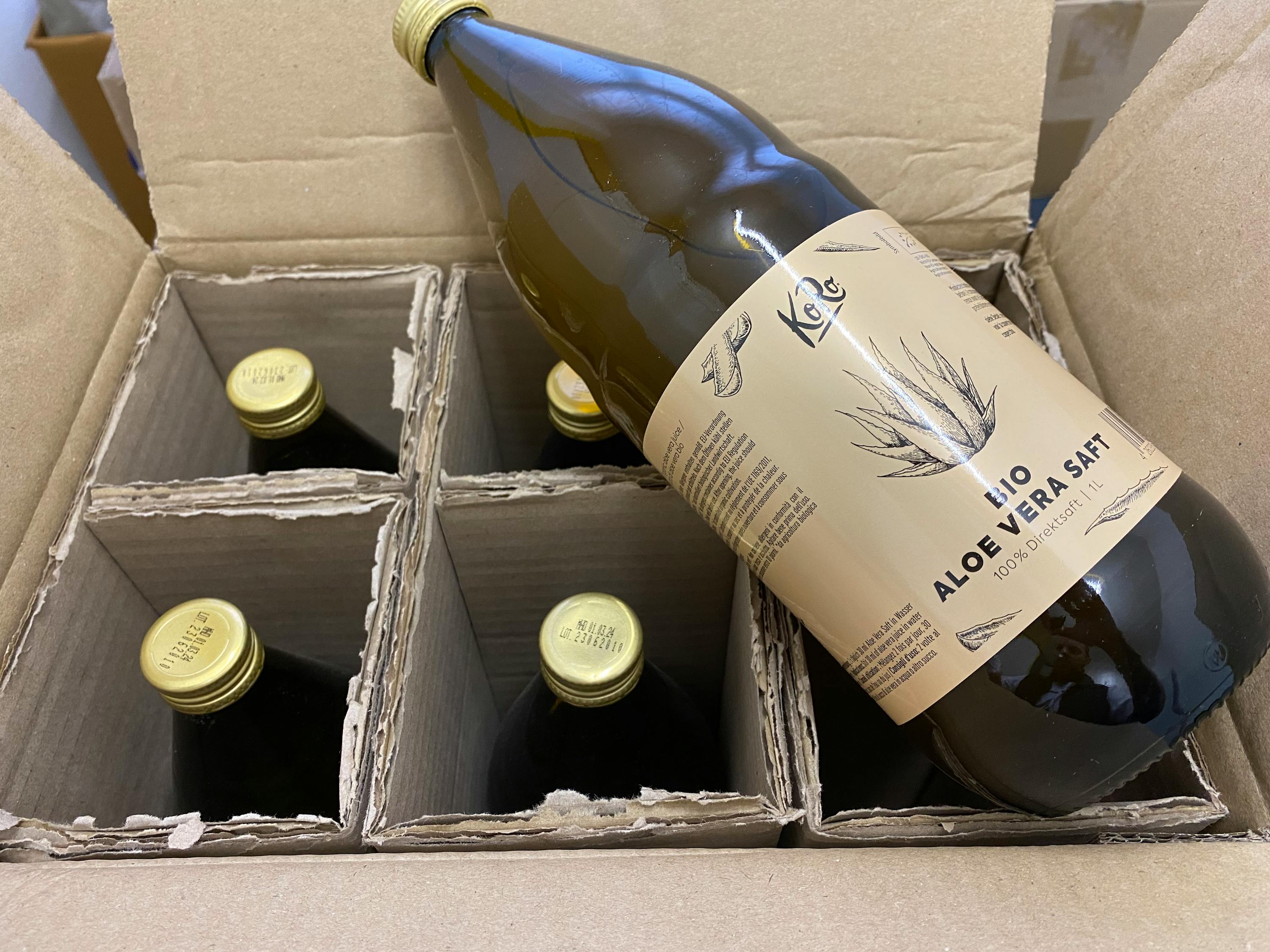 a bottle of aloe vera salt sits in a cardboard box