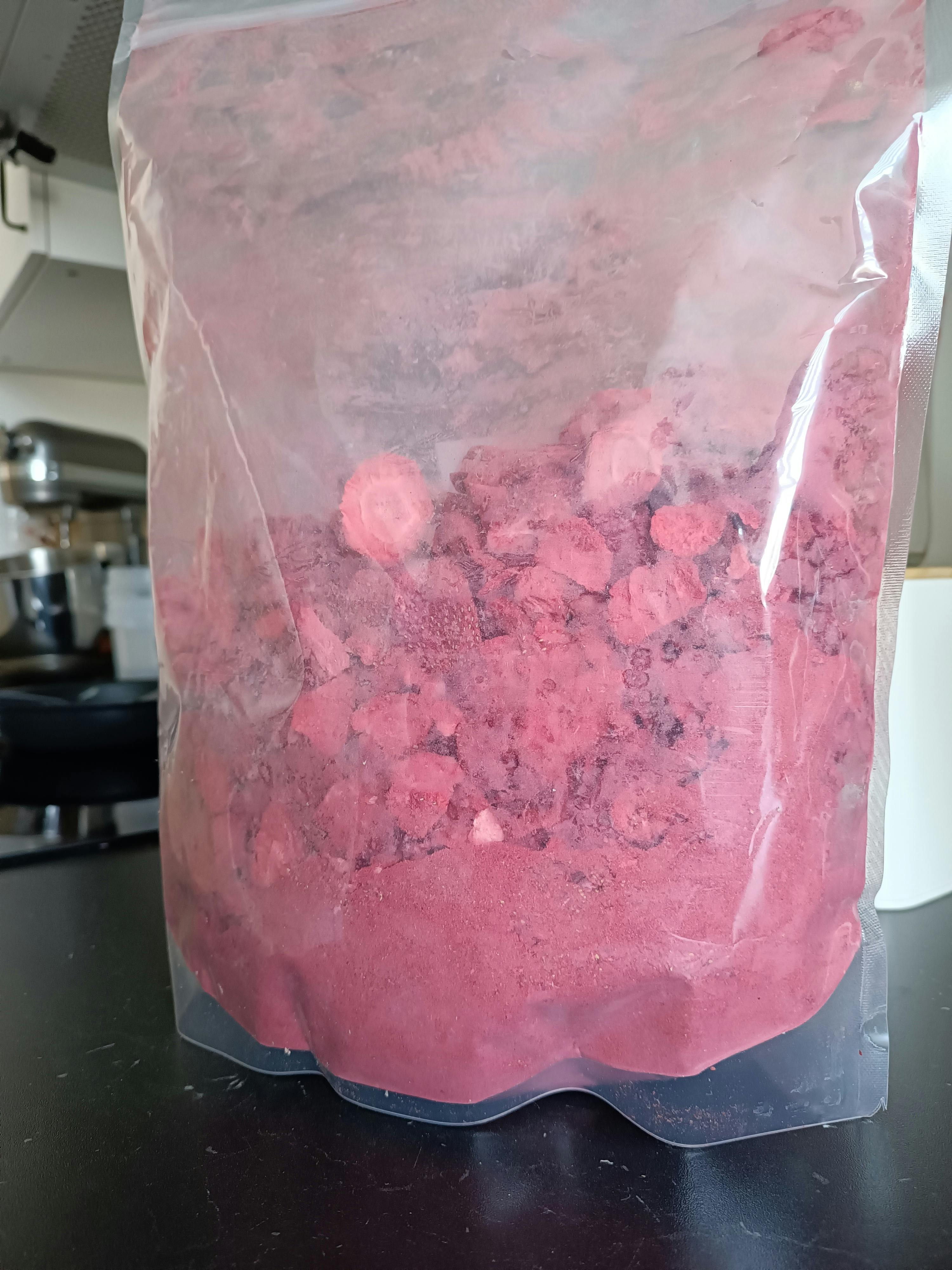a bag of pink powder is sitting on a counter