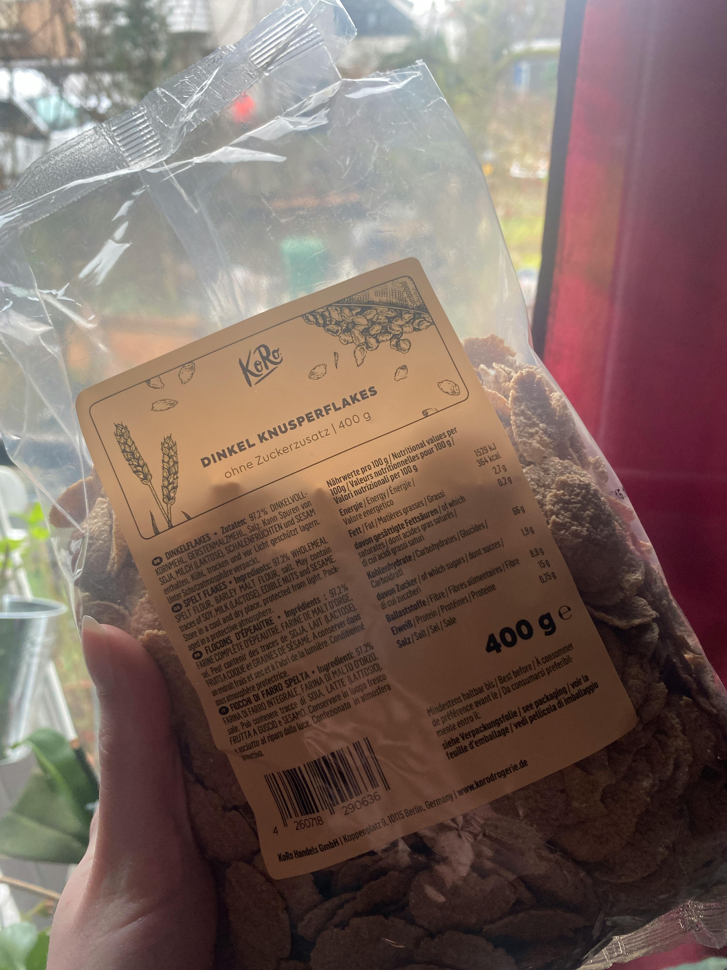 a person is holding a bag of dimel kruidenflakkers