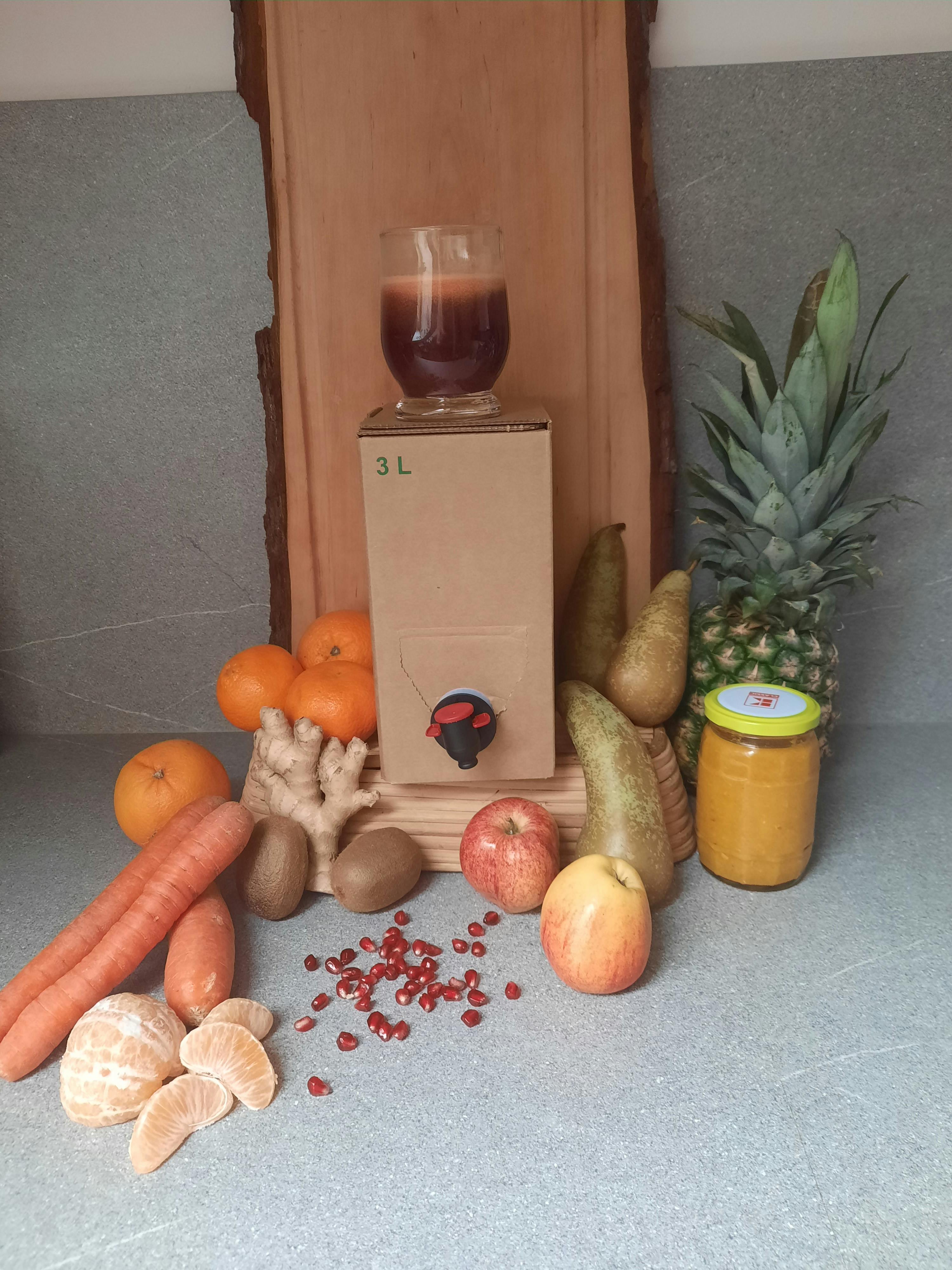 a box that says 3l is surrounded by fruit and vegetables