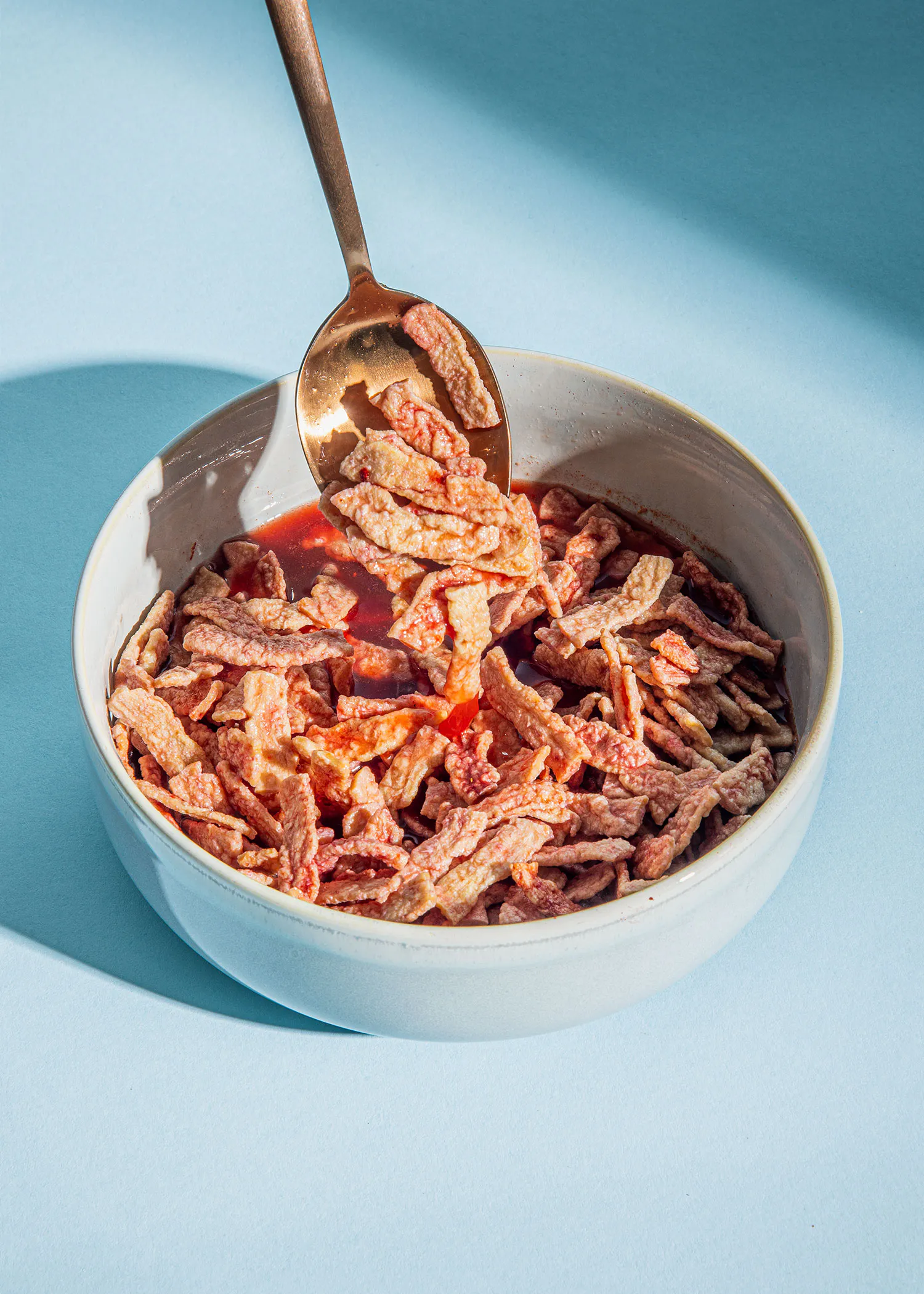 a bowl of food with a spoon in it