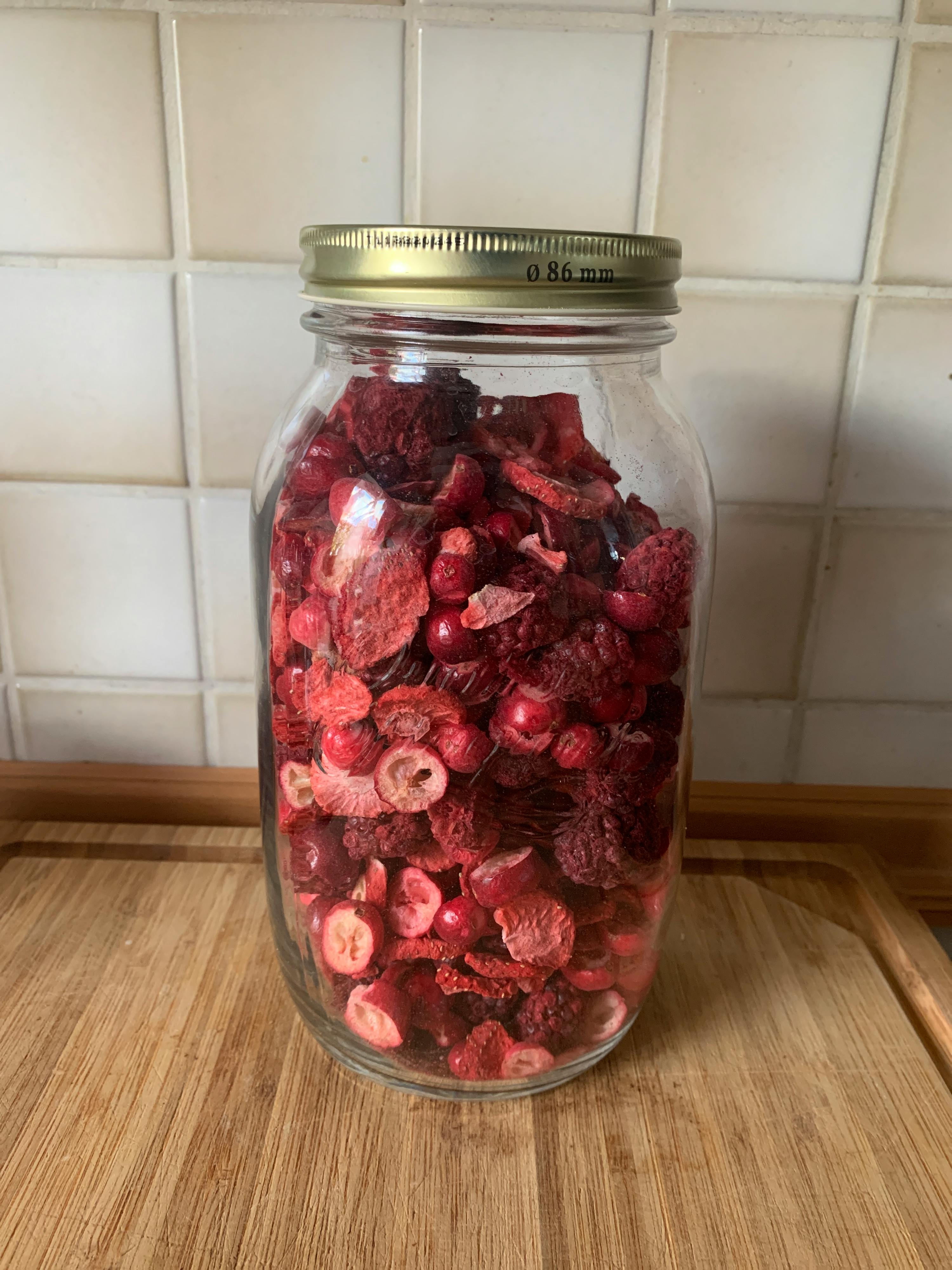a jar filled with dried berries has a lid that says 0.86 mm on it