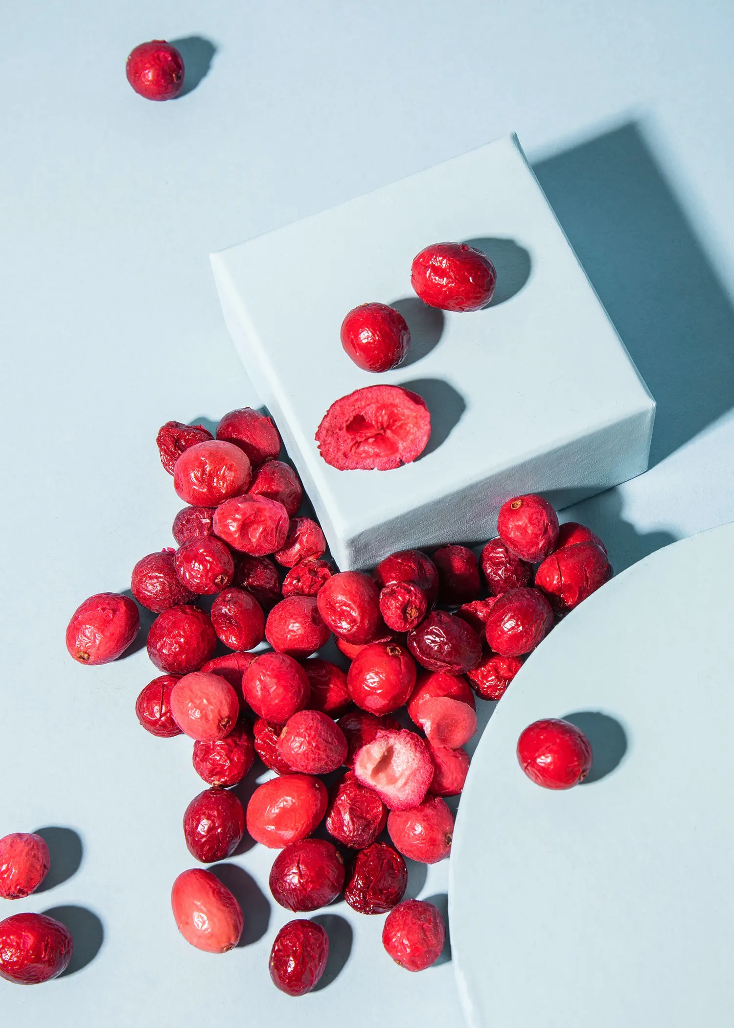 a white box filled with dried cranberries on a table