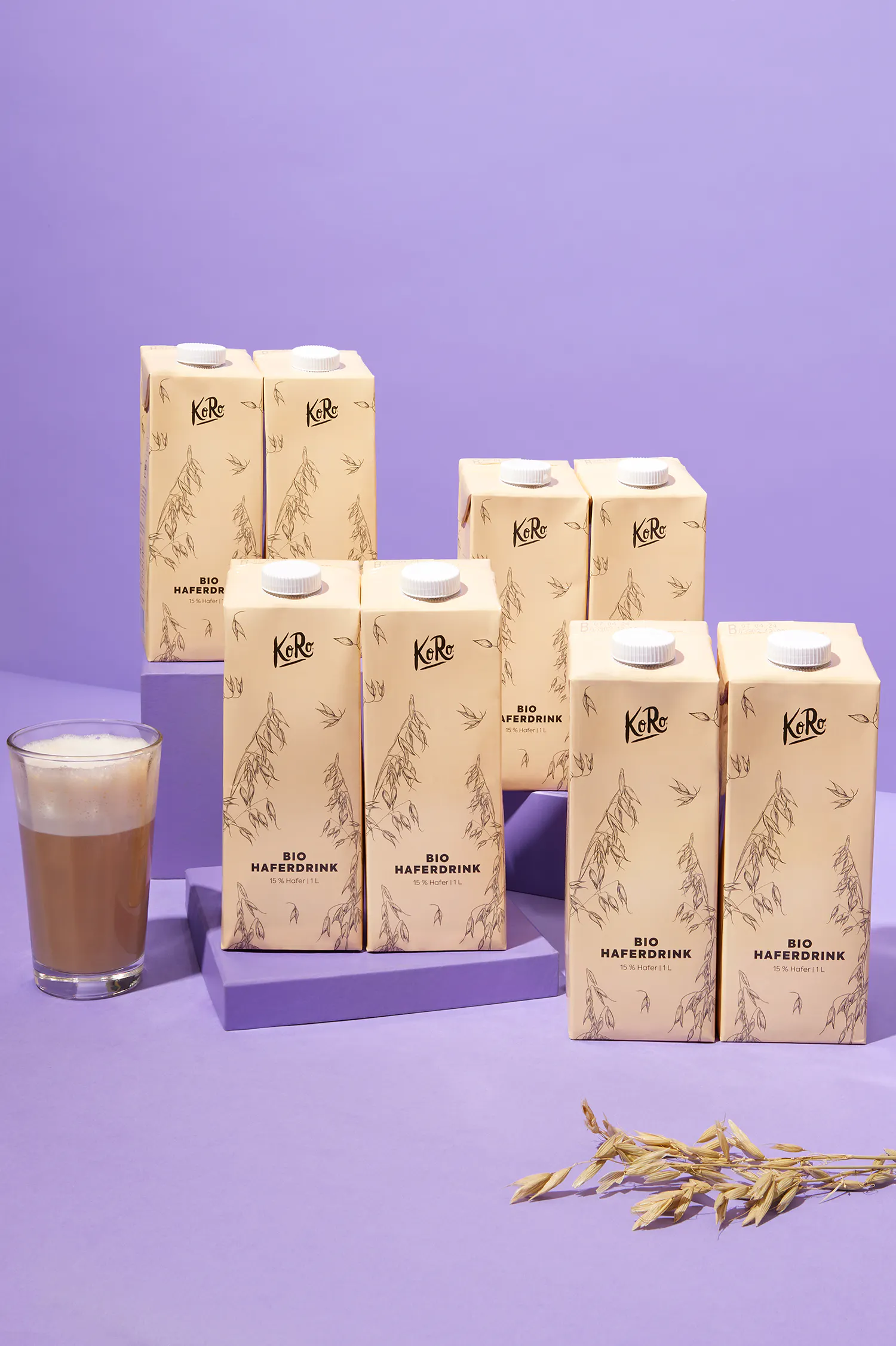 boxes of bio haferdrink are lined up on a purple surface