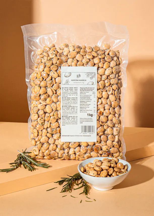 a bag of chickpeas sits on a table next to a bowl of chickpeas